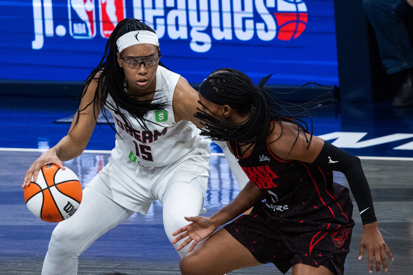 Atlanta Dream guard Allisha Gray (15) dribbles the ball while Indiana Fever guard Shey Peddy (5) defends during game two of round one for the 2025 WNBA Playoffs at Gainbridge Fieldhouse.