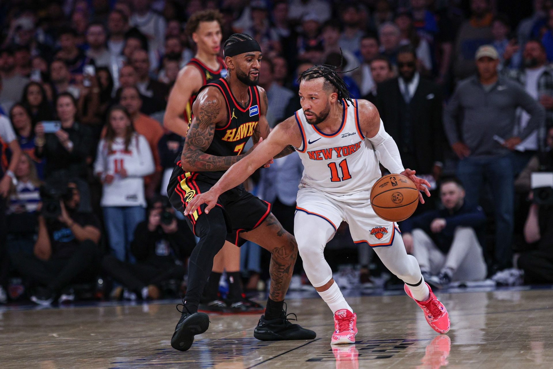 New York Knicks guard Jalen Brunson (11) dribbles as Atlanta Hawks guard Nickeil Alexander-Walker (7) defends during the second half of the 2026 NBA Playoffs at Madison Square Garden - Source: Imagn Images