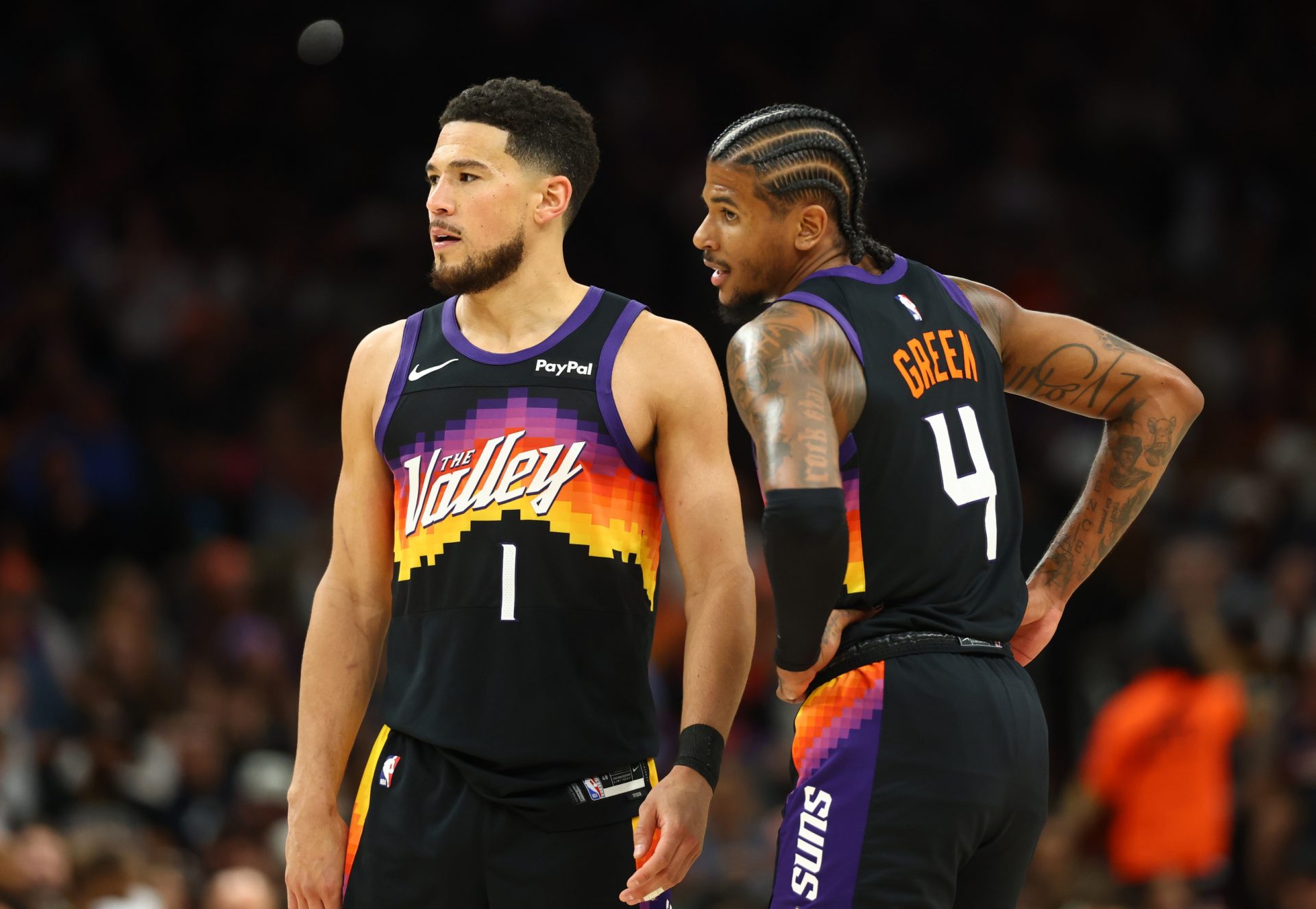 Phoenix Suns guard Devin Booker (1) and Jalen Green (4) against the Houston Rockets in the second half at Mortgage Matchup Center.