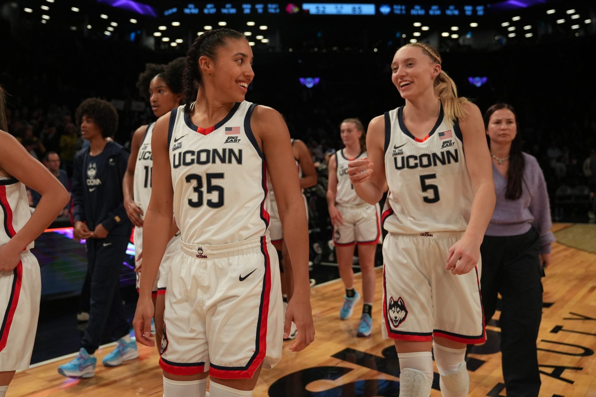 Connecticut Huskies guard Azzi Fudd (35) and Connecticut Huskies guard Paige Bueckers (5) celebrate after the game against the Louisville Cardinals at Barclays Center - Source: Imagn Images