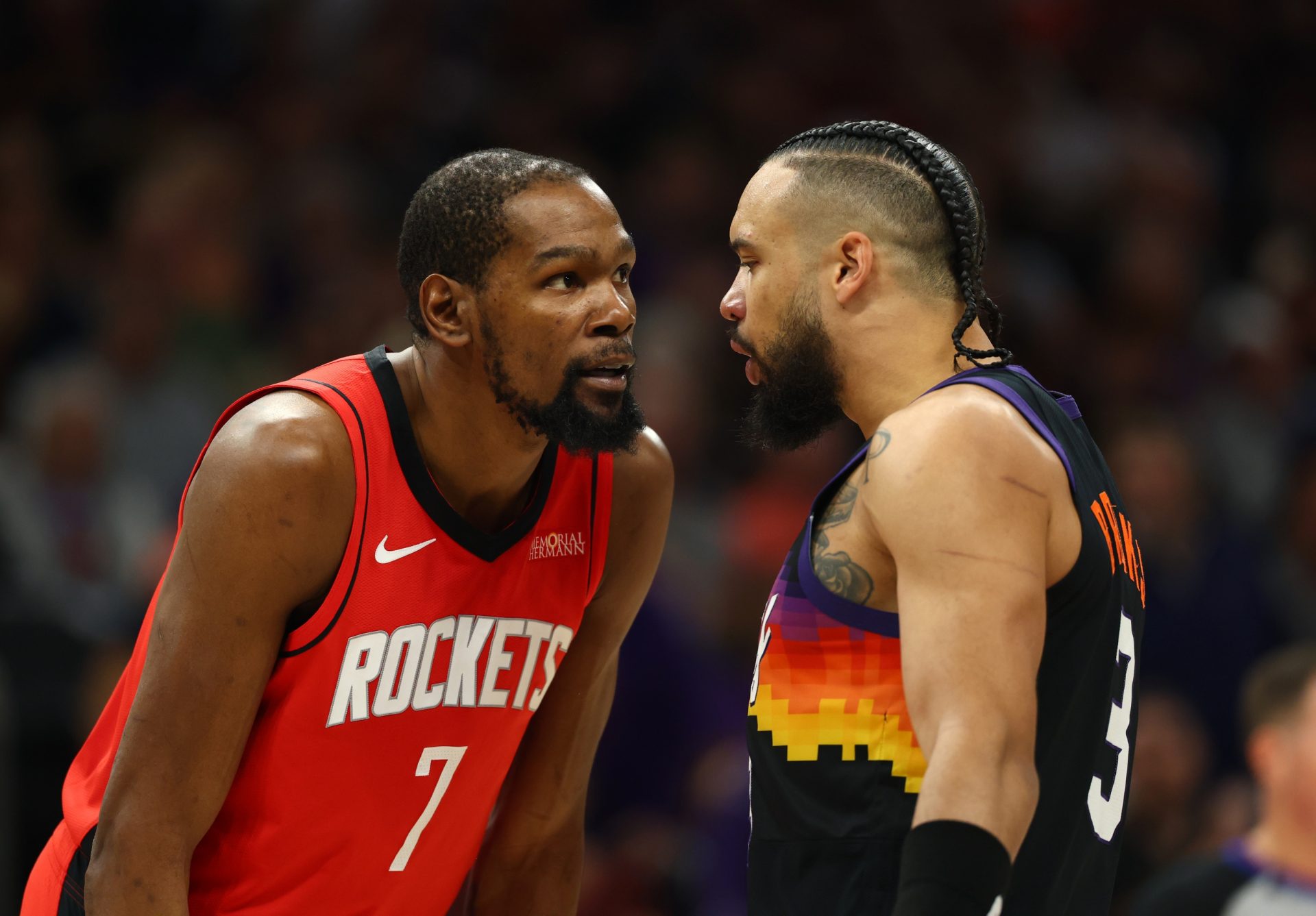 Houston Rockets forward Kevin Durant (7) argues with Phoenix Suns forward Dillon Brooks (3) in the first half at Mortgage Matchup Center. - Source: Imagn