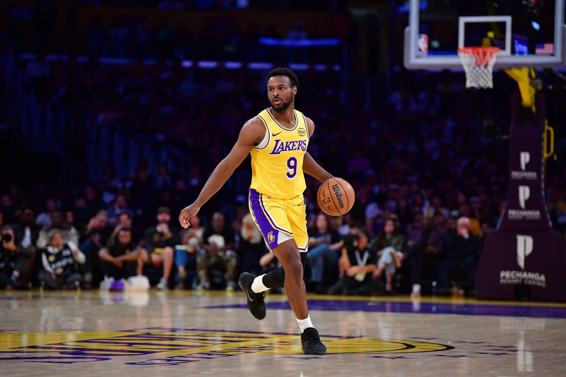 Los Angeles Lakers guard Bronny James (9) controls the ball against the Oklahoma City Thunder during the first half at Crypto.com Arena. - Source: Imagn