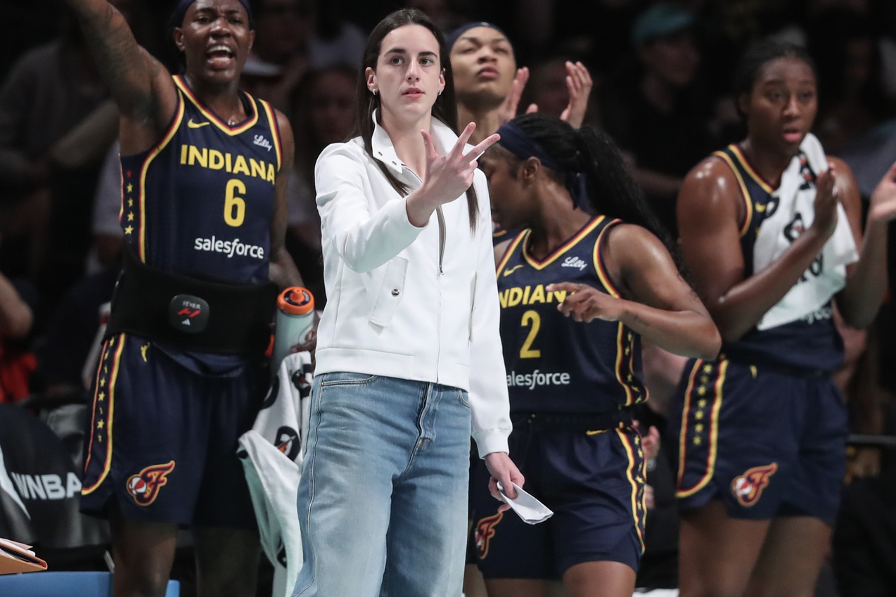 Indiana Fever guard Caitlin Clark (not in uniform) celebrates from the bench in the first quarter against the New York Liberty at Barclays Center - Source: Imagn Images