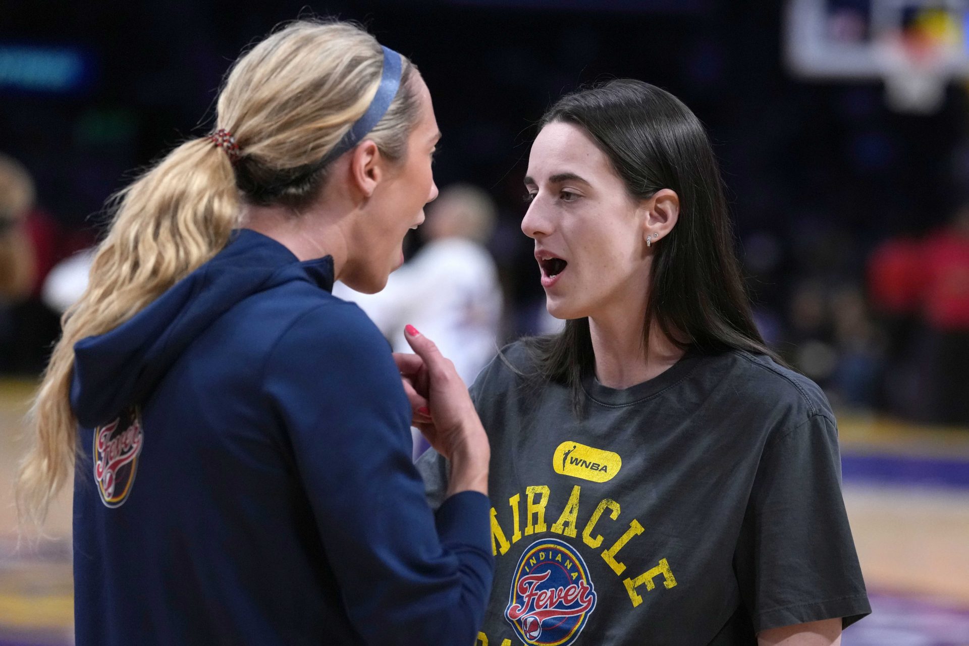 Indiana Fever guard Caitlin Clark (right) talks with guard Lexie Hull during the game against the LA Sparks at the Crypto.com Arena. - Source: Imagn