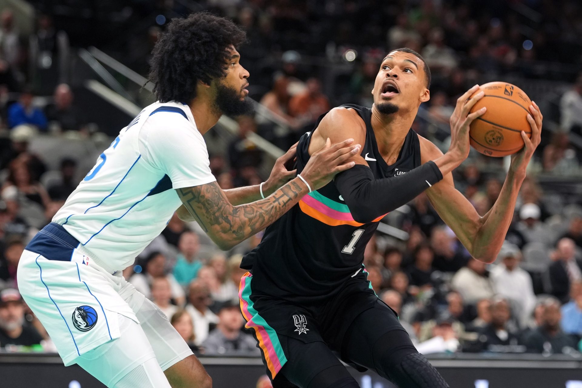 San Antonio Spurs forward Victor Wembanyama (1) drives to the basket against Dallas Mavericks forward Marvin Bagley, Jr. (35) during the first half at Frost Bank Center. - Source: Imagn