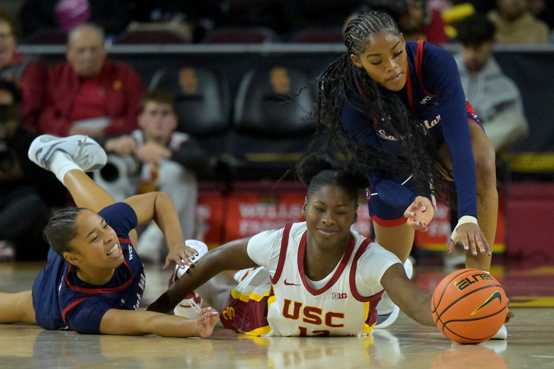 Saint Mary's Gaels guard Charlece Ohiaeri (4), guard Jada Hunter (0) and USC Trojans forward Dayana Mendes (13) reach for a loose ball during the first half at Galen Center -
Source: Imagn