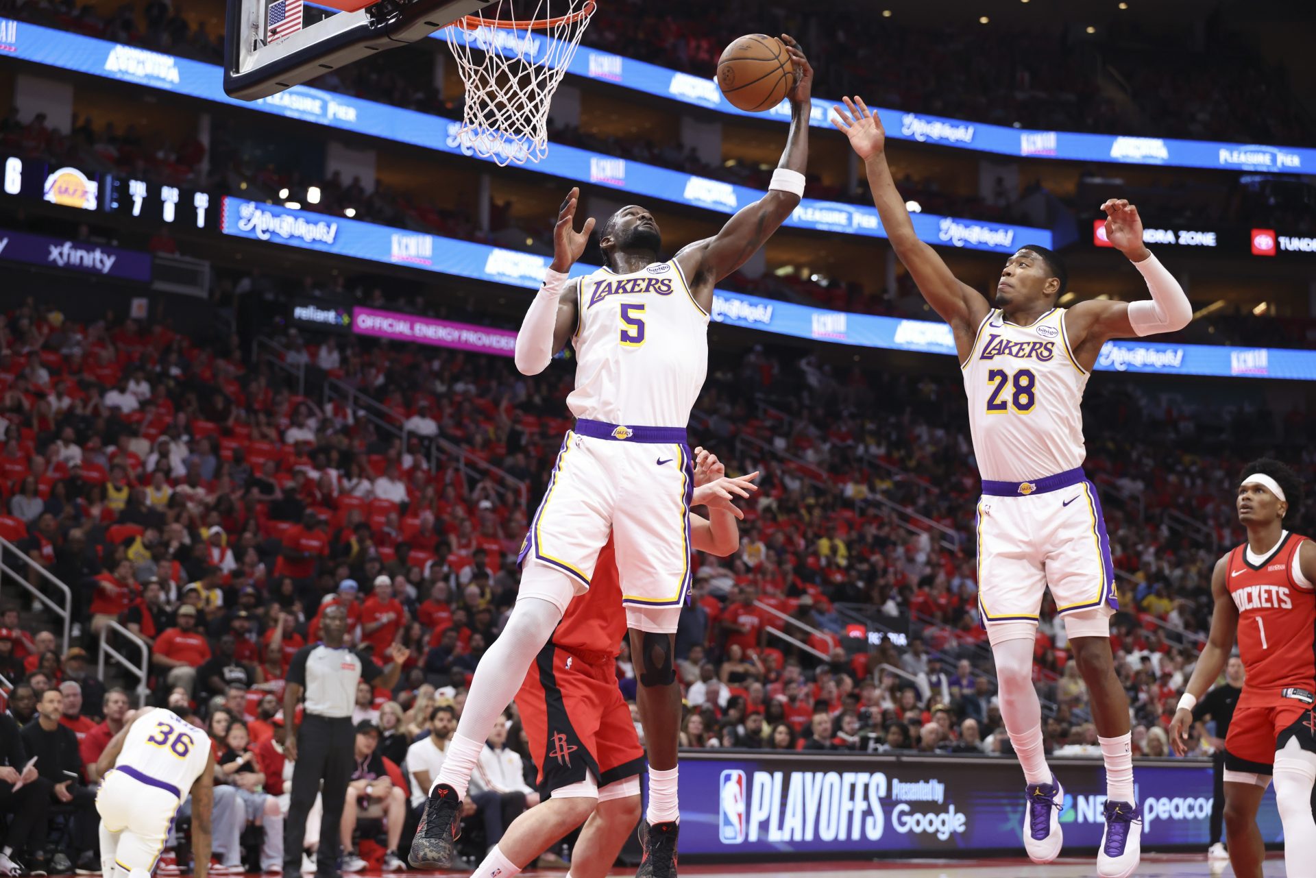 Los Angeles Lakers center Deandre Ayton (5) grabs a rebound during the first quarter against the Houston Rockets during game four of the first round of the 2026 NBA Playoffs at Toyota Center.