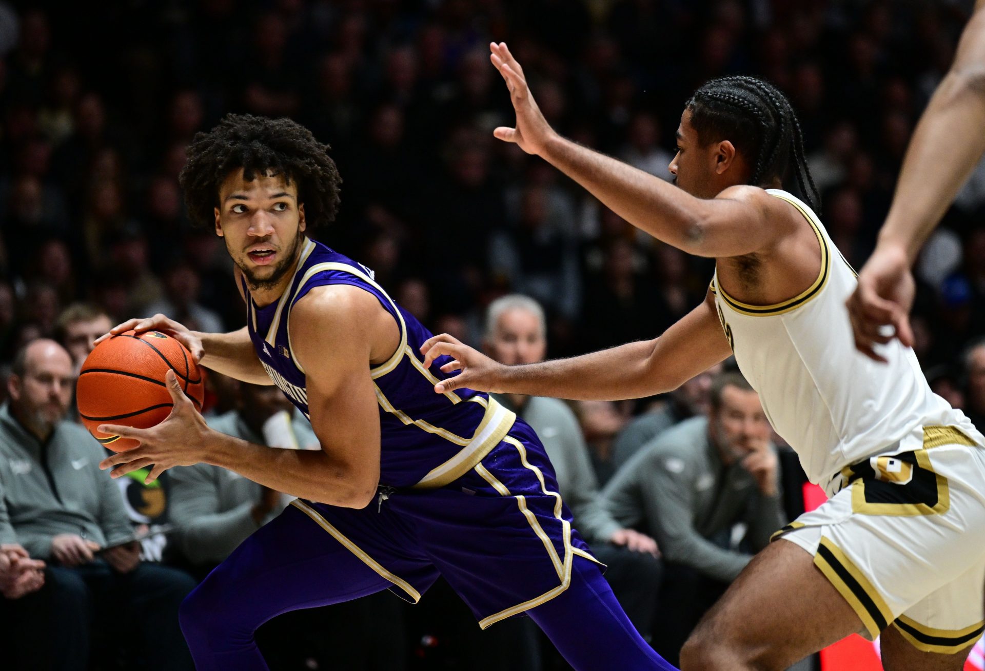 Washington Huskies guard Desmond Claude (1) looks to get past Purdue Boilermakers guard C.J. Cox (0) during the first half at Mackey Arena. Source: Imagn