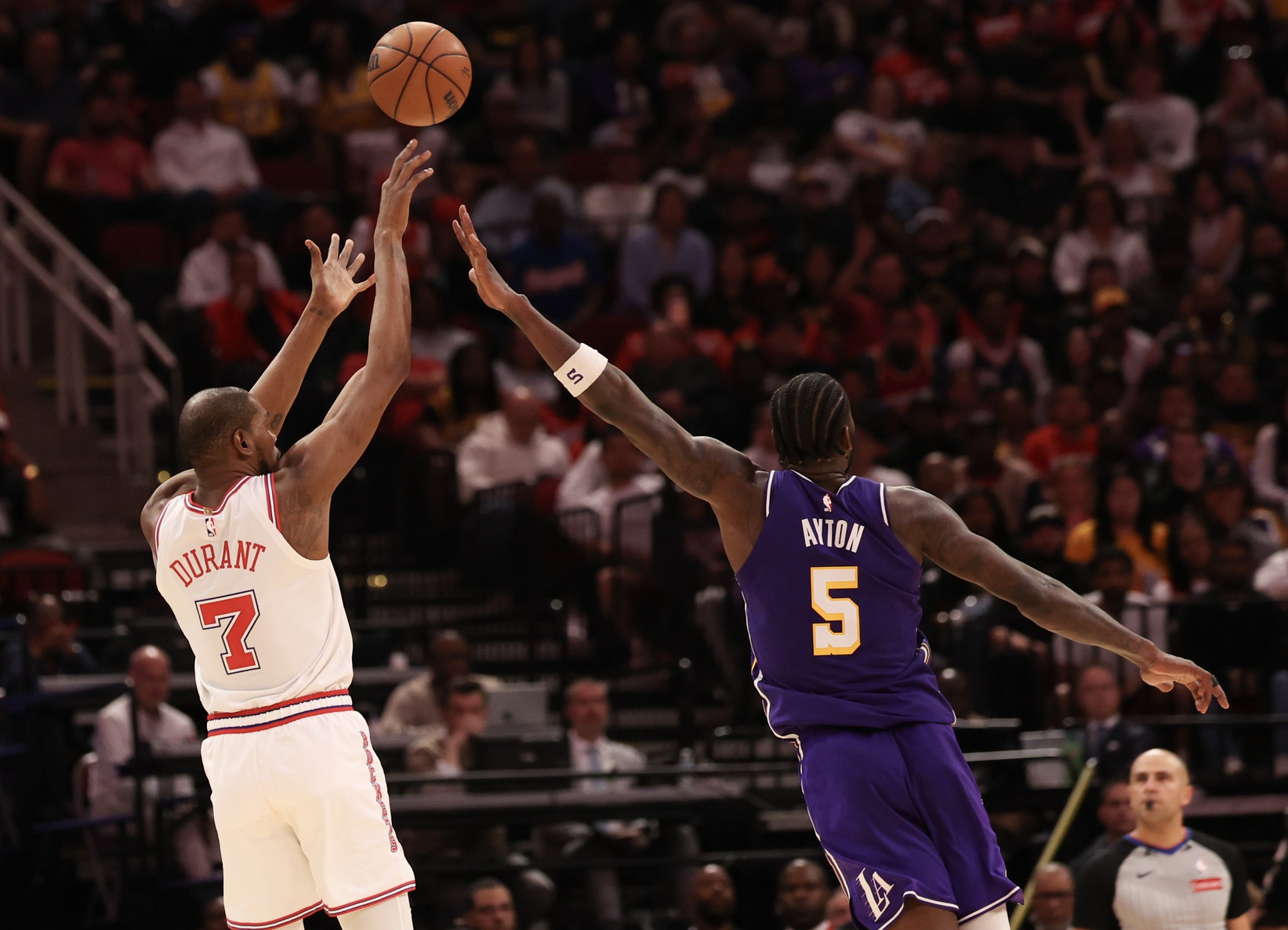 Houston Rockets forward Kevin Durant (7) makes a three point basket against Los Angeles Lakers center Deandre Ayton (5) in the second half at Toyota Center - Source: Imagn Images