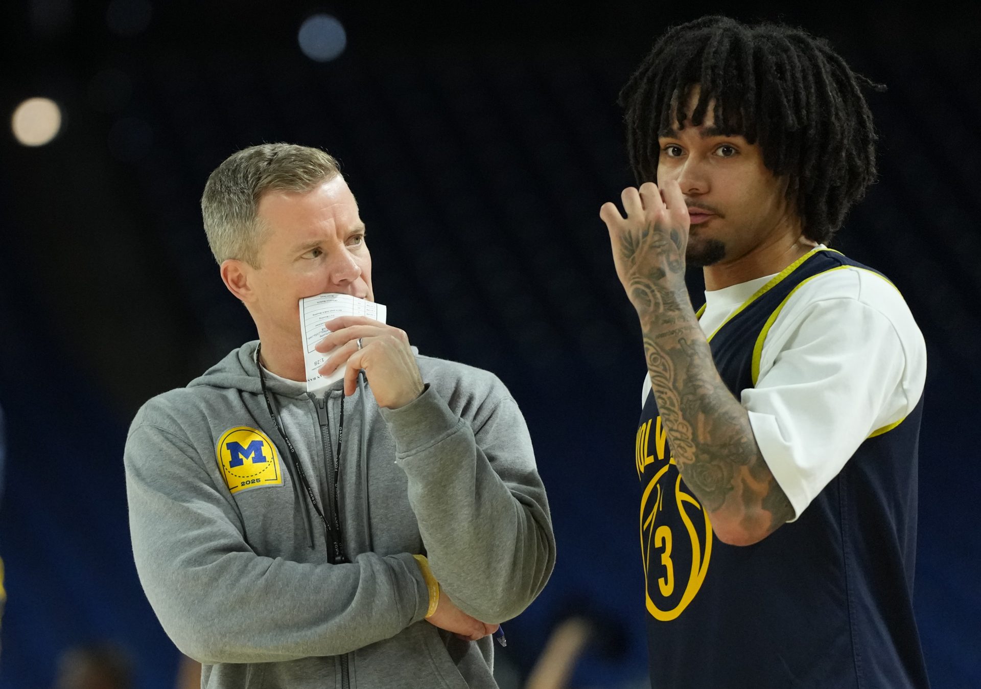 Michigan Wolverines head coach Dusty May talks with Michigan Wolverines guard Elliot Cadeau (3) during a practice. Source: IMAGN