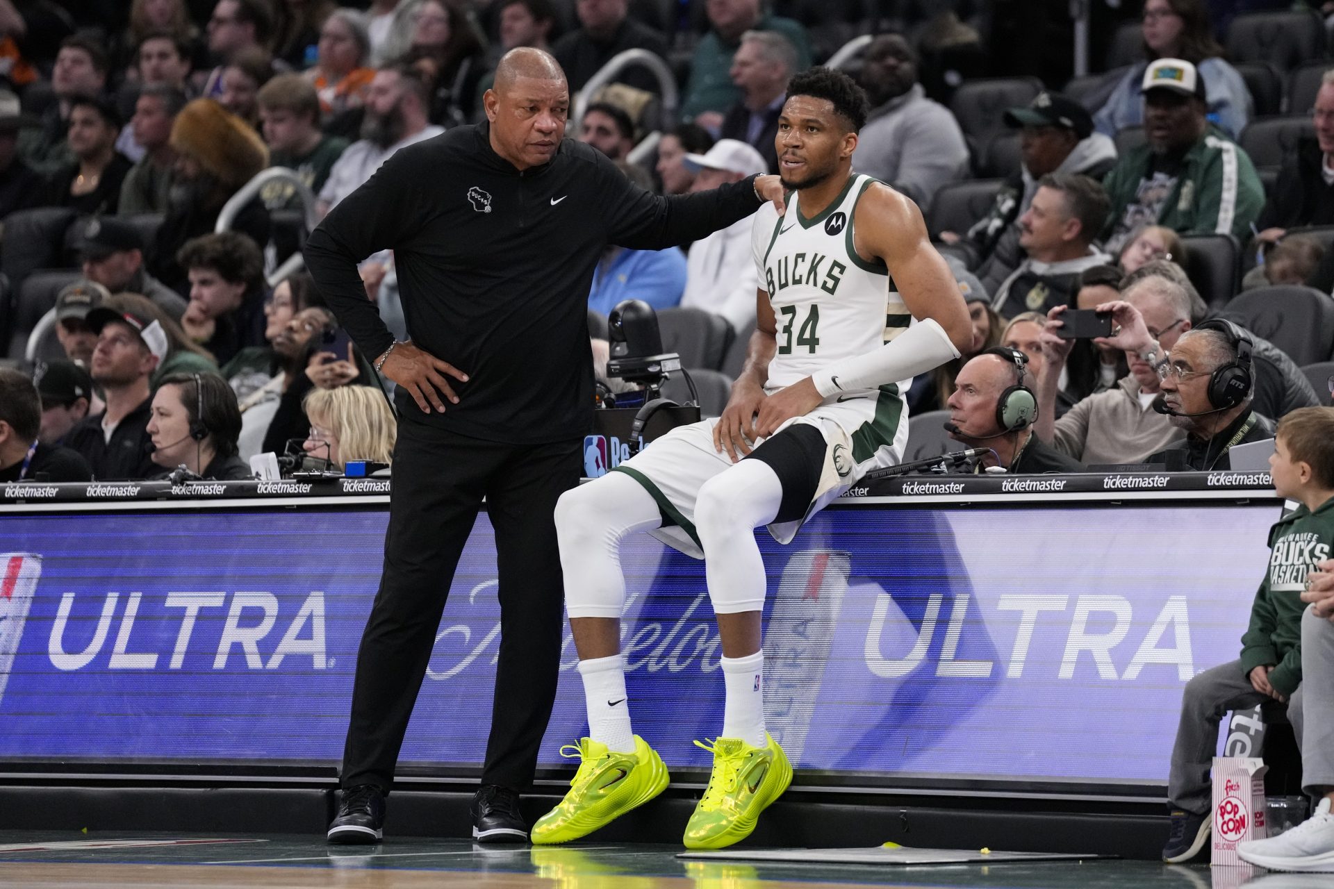 Milwaukee Bucks forward Giannis Antetokounmpo (34) talks with head coach Doc Rivers while sitting on the scorers table during the third quarter against the Phoenix Suns at Fiserv Forum. - Source: Imagn