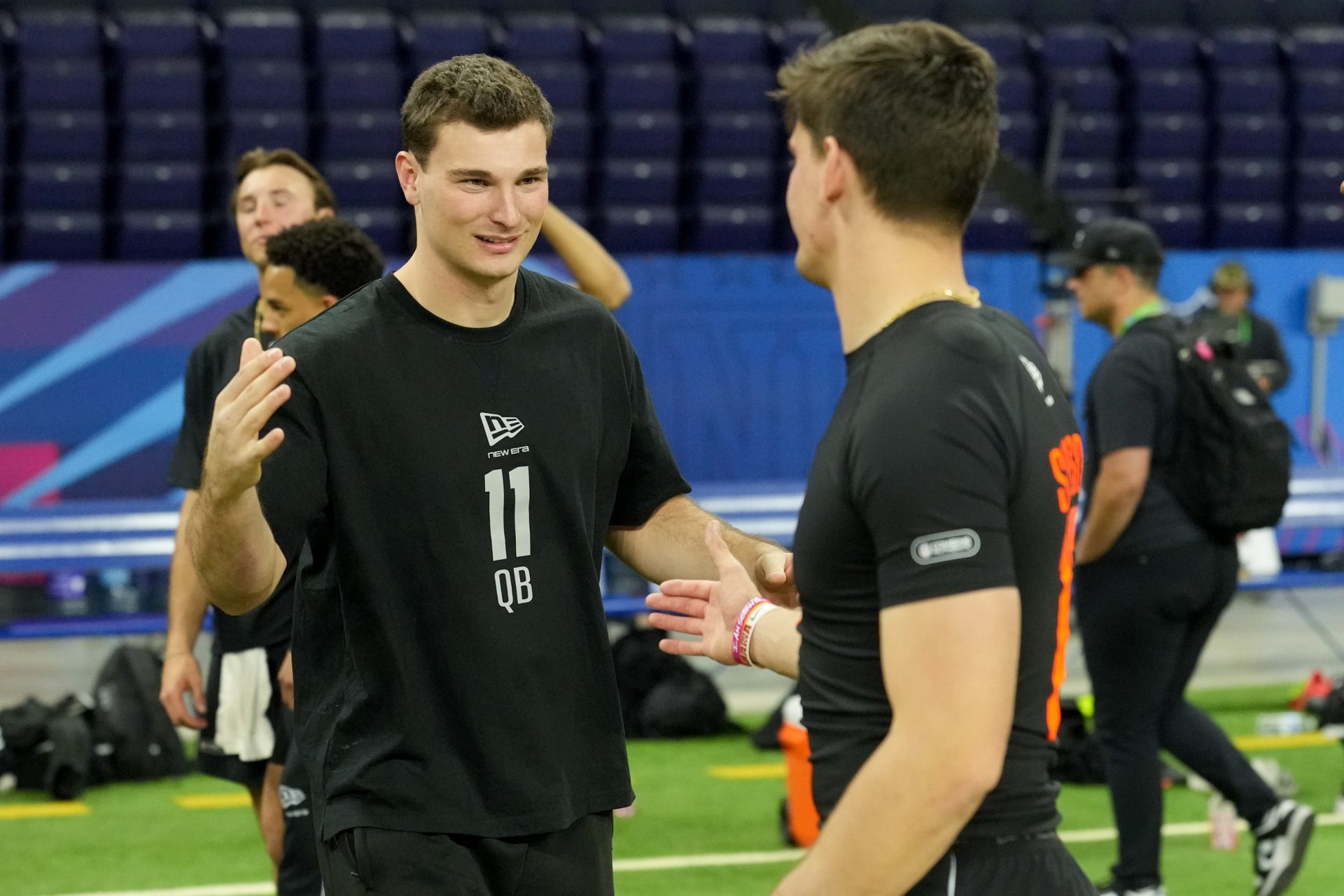Indiana quarterback Fernando Mendoza (QB11) greets Alabama quarterback Ty Simpson (QB17) during the NFL Scouting Combine at Lucas Oil Stadium. Source: Imagn
