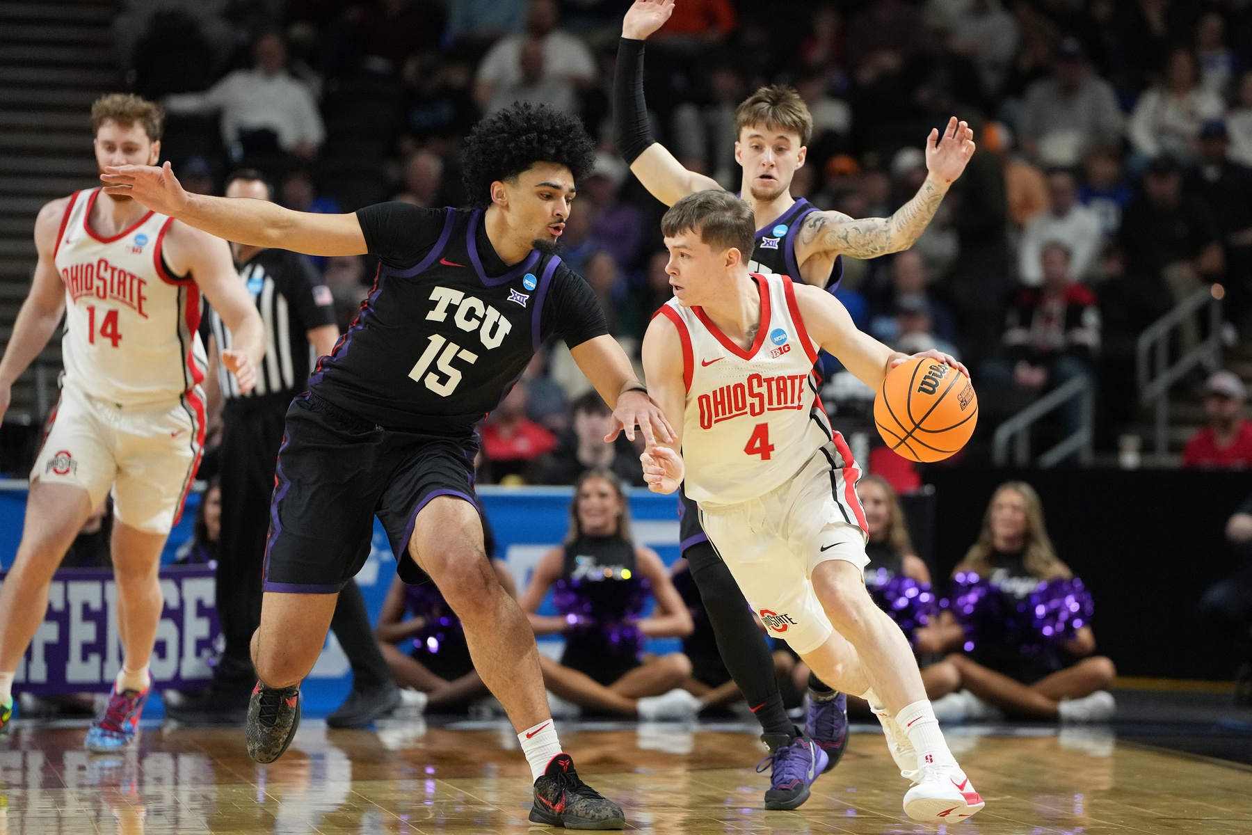 Ohio State Buckeyes Gabe Cupps (4) dribbles the ball against Texas Christian University Horned Frogs David Punch (15) in the first half during a first round game of the men's 2026 NCAA Tournament at Bon Secours Wellness Arena. Source: Imagn
