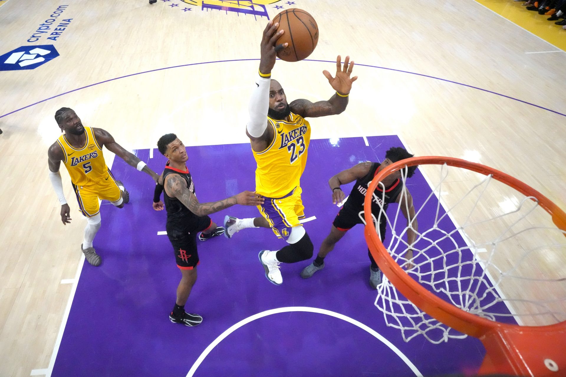 Los Angeles Lakers forward LeBron James (23) shoots the ball against Houston Rockets forward Jabari Smith Jr. (10) and guard Amen Thompson (1) in the second half during game one of the first round of the 2026 NBA Playoffs at Crypto.com Arena.