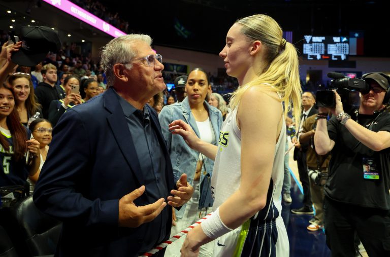 University of Connecticut head coach Geno Auriemma speaks with Dallas Wings guard Paige Bueckers (5) after the game against the Golden State Valkyries at College Park Center.
