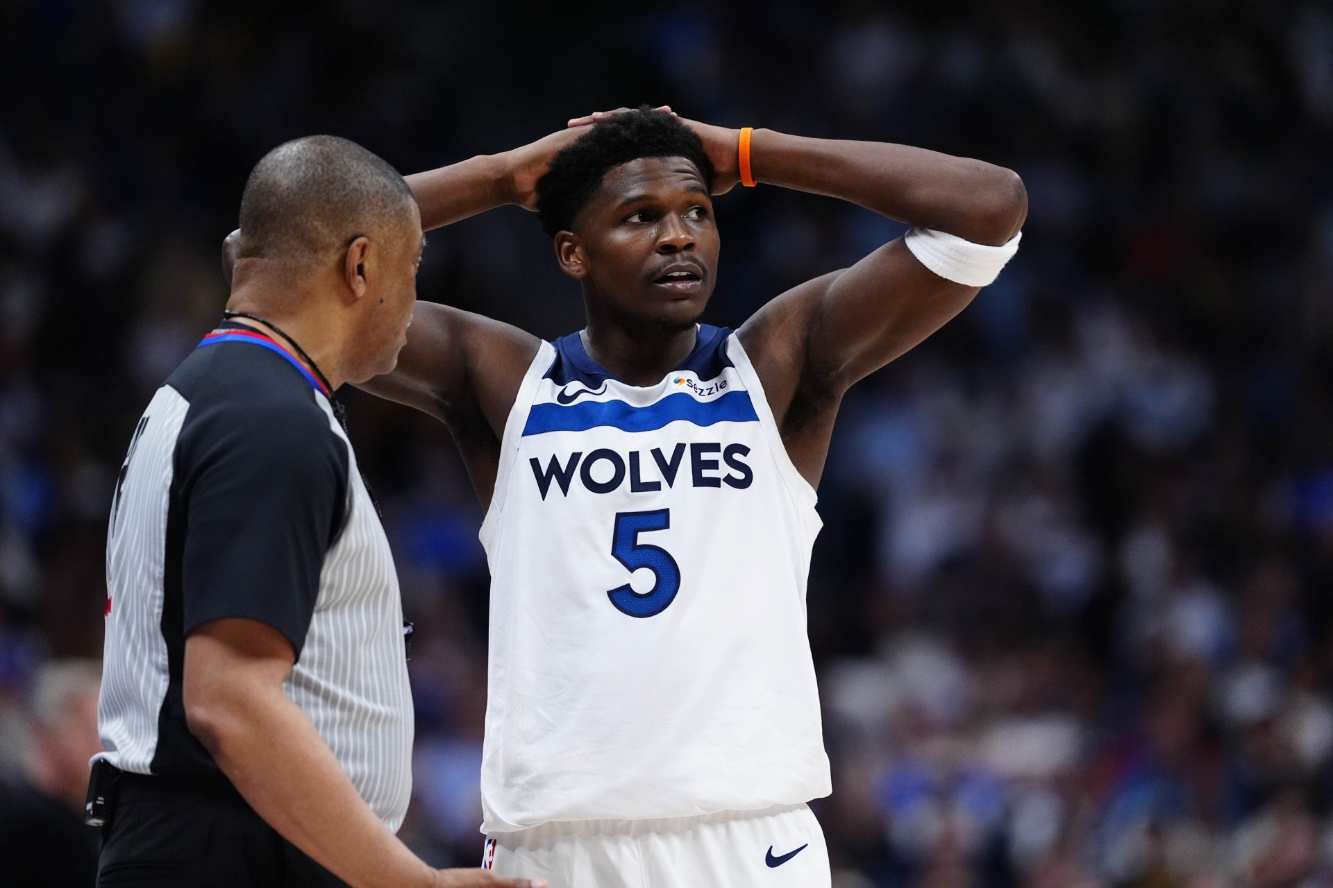 Minnesota Timberwolves guard Anthony Edwards (5) next to referee Tony Brothers (25) in the second half against the Denver Nuggets during game two of the first round of the 2026 NBA Playoffs at Ball Arena - Source: Imagn Images