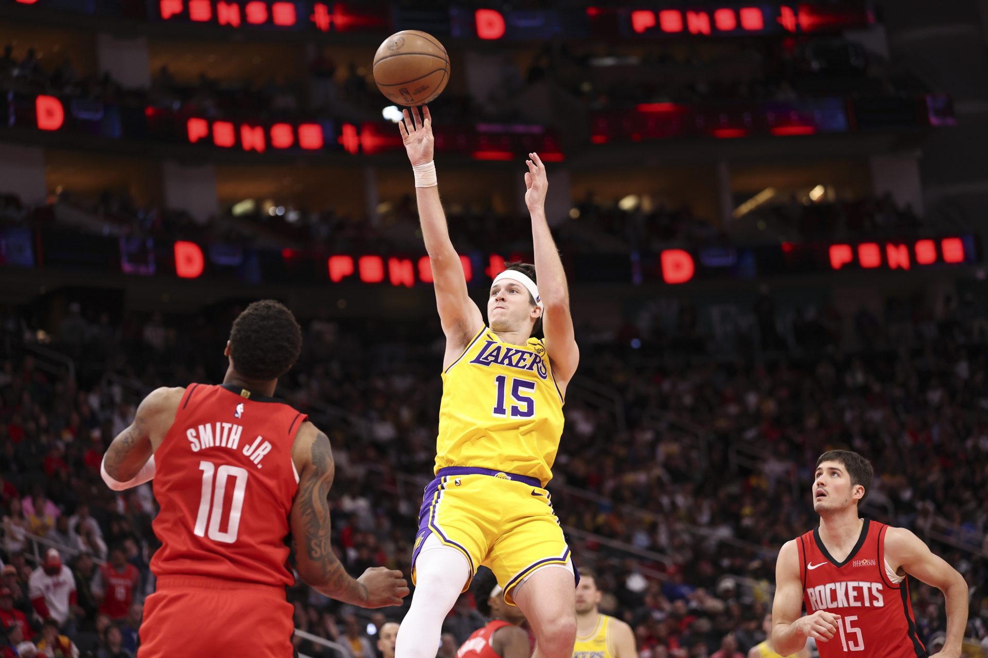 Los Angeles Lakers guard Austin Reaves (15) shoots the ball during the third quarter against the Houston Rockets at Toyota Center.