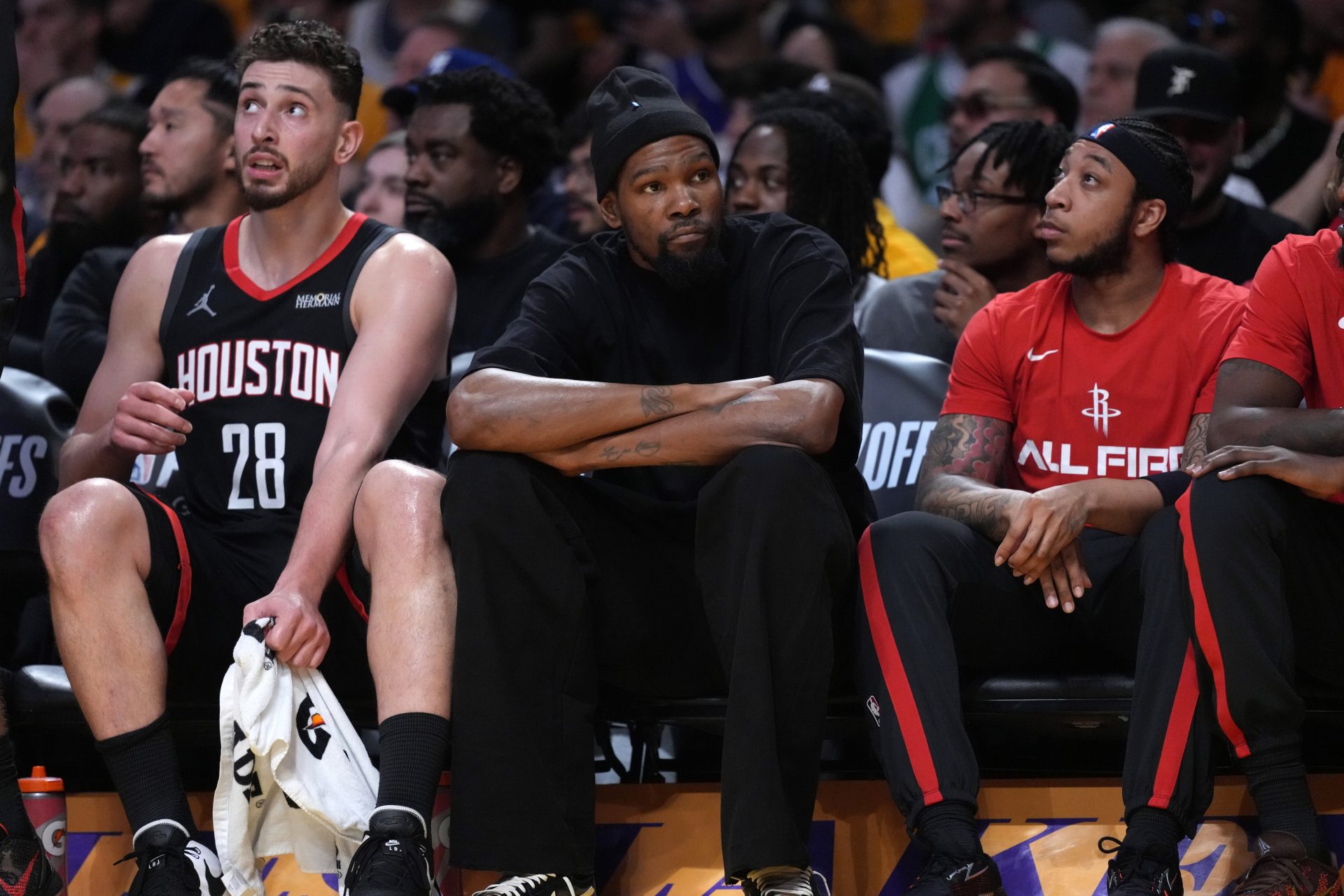 Houston Rockets center Alperen Sengun (28) and forward Kevin Durant (center) watch during the first half against the Los Angeles Lakers during game one of the first round of the 2026 NBA Playoffs at Crypto.com Arena.