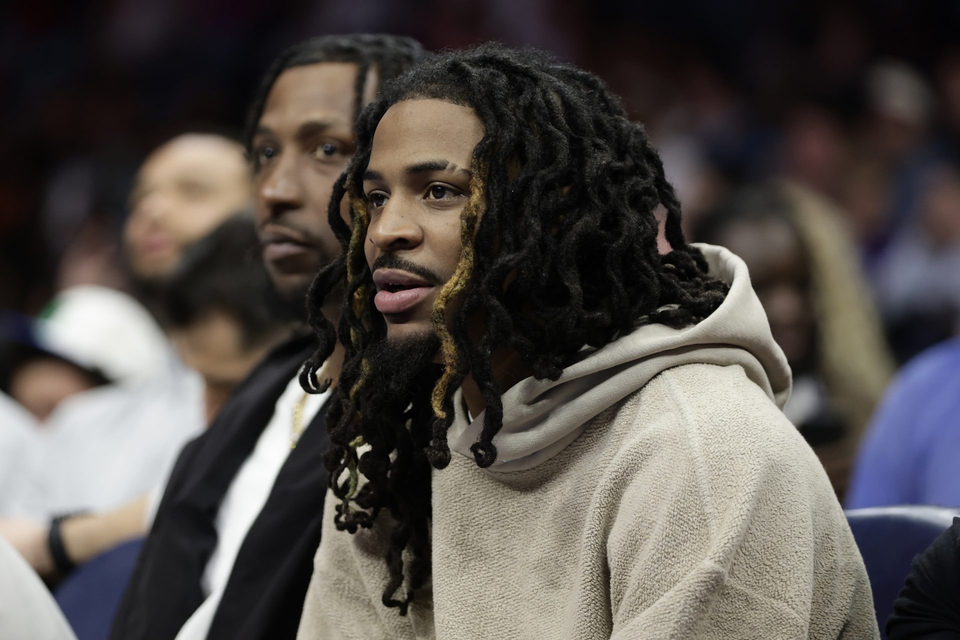 Memphis Grizzlies guard Ja Morant watches from the bench during the second half against the Charlotte Hornets at Spectrum Center - Source: Imagn Images