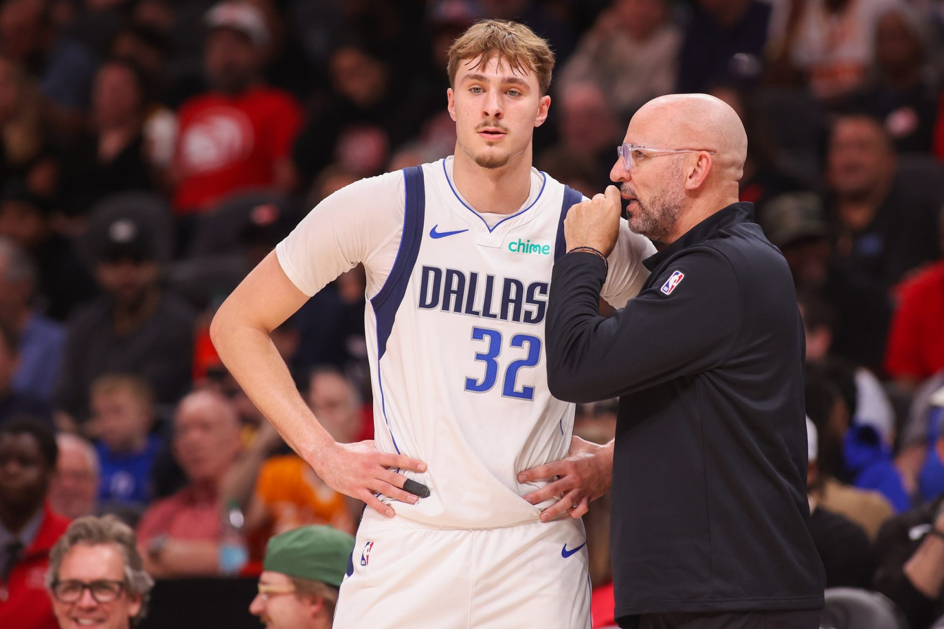 Dallas Mavericks forward Cooper Flagg (32) talks to head coach Jason Kidd against the Atlanta Hawks in the first quarter at State Farm Arena. - Source: Imagn