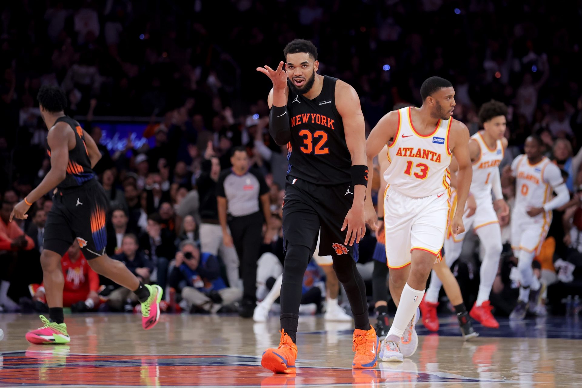 New York Knicks center Karl-Anthony Towns (32) celebrates his three point shot against the Atlanta Hawks during the third quarter of game two of the first round of the 2026 NBA Playoffs at Madison Square Garden - Source: Imagn Images