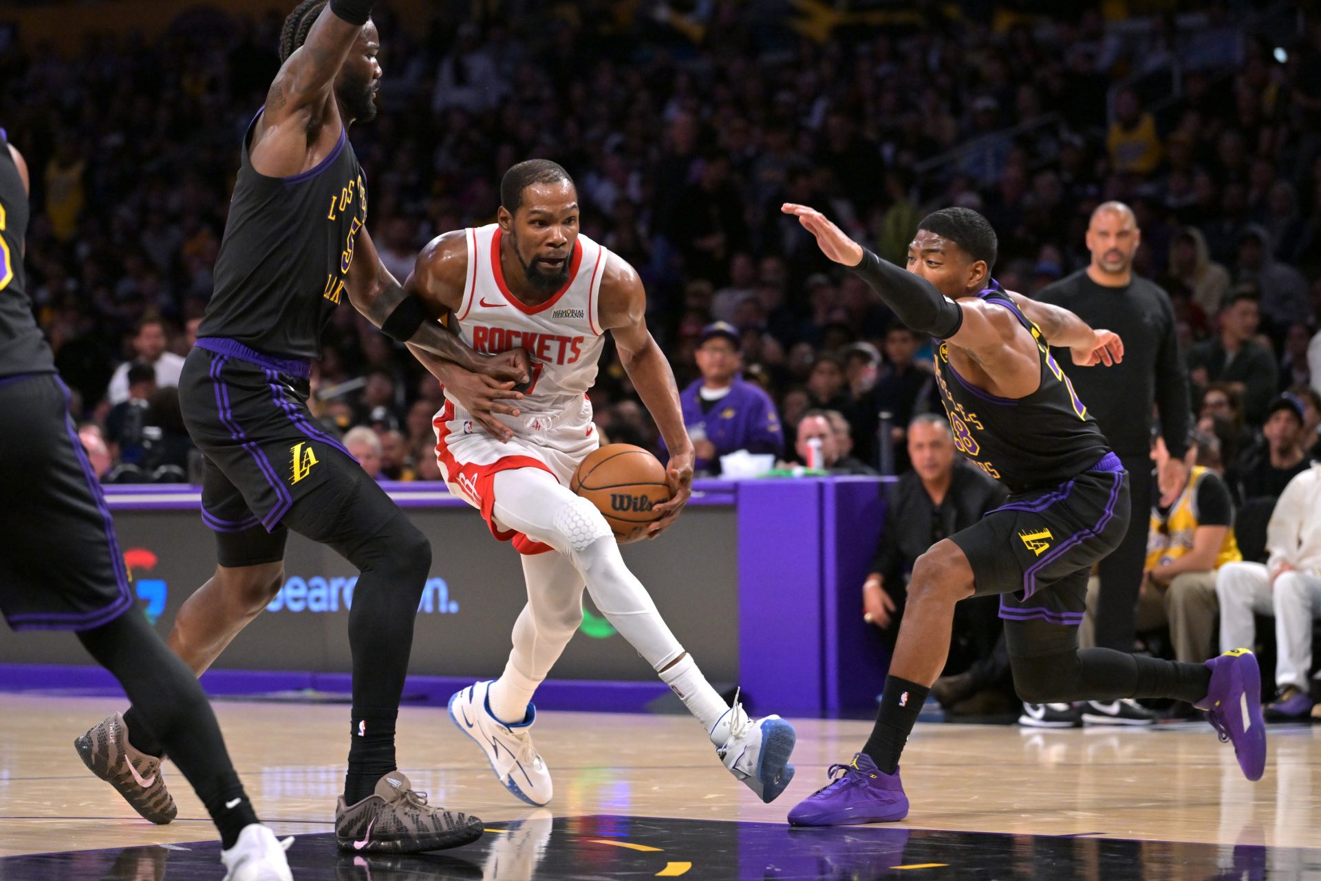 Houston Rockets forward Kevin Durant (7) is defended by Los Angeles Lakers center Deandre Ayton (5) as he drives to the basket during the second half of game two of the first round of the 2026 NBA Playoffs at Crypto.com Arena.