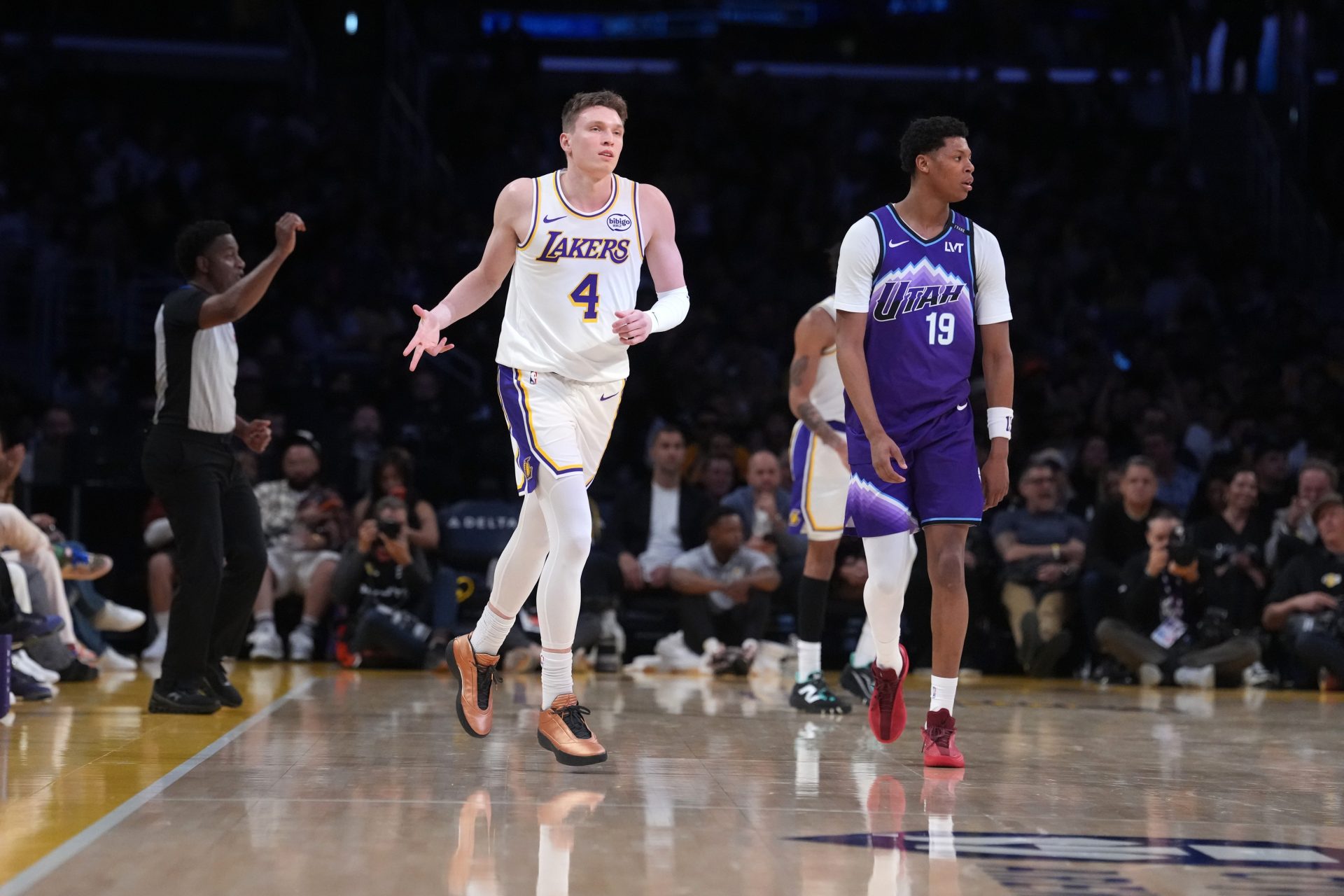 Los Angeles Lakers forward Dalton Knecht (4) reacts after a three-point basket as Utah Jazz guard Ace Bailey (19) watches in the first half at Crypto.com Arena - Source: Imagn Images