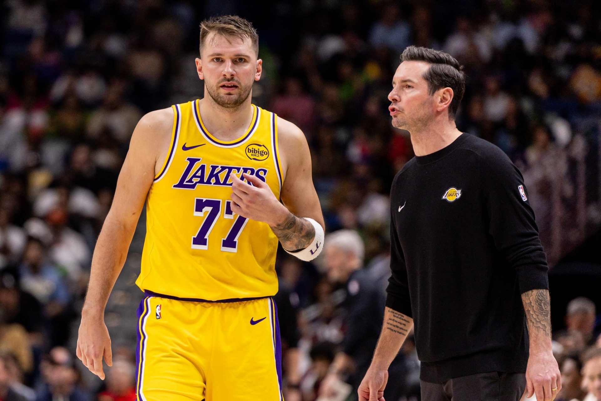 Los Angeles Lakers forward/guard Luka Doncic (77) talks to Head Coach JJ Redick against the New Orleans Pelicans during the second half at Smoothie King Center. - Source: Imagn