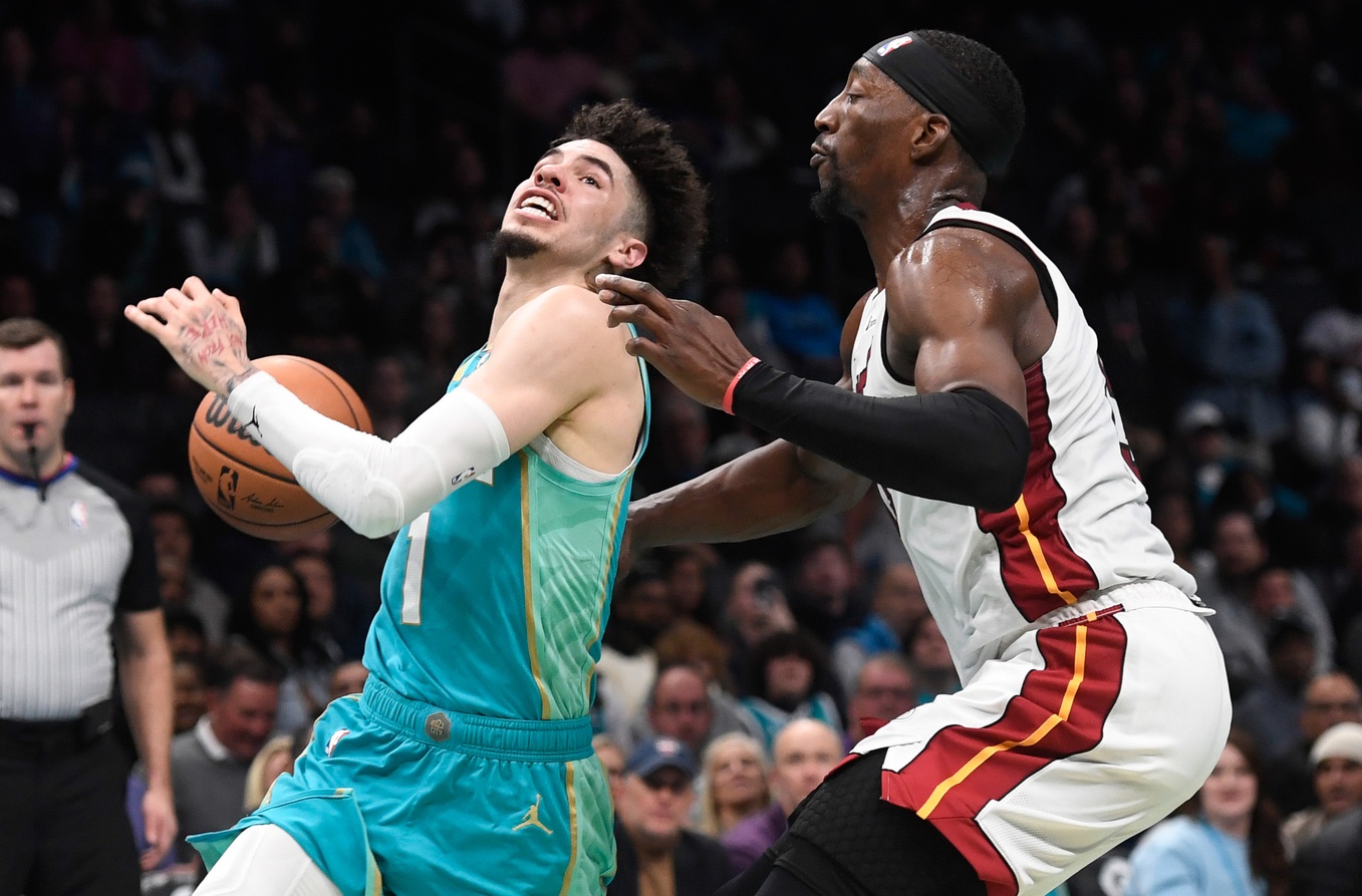 Charlotte Hornets guard LaMelo Ball (1) drives past Miami Heat center forward Bam Adebayo (13) during the second half at the Spectrum Center - Source: USA TODAY Sports