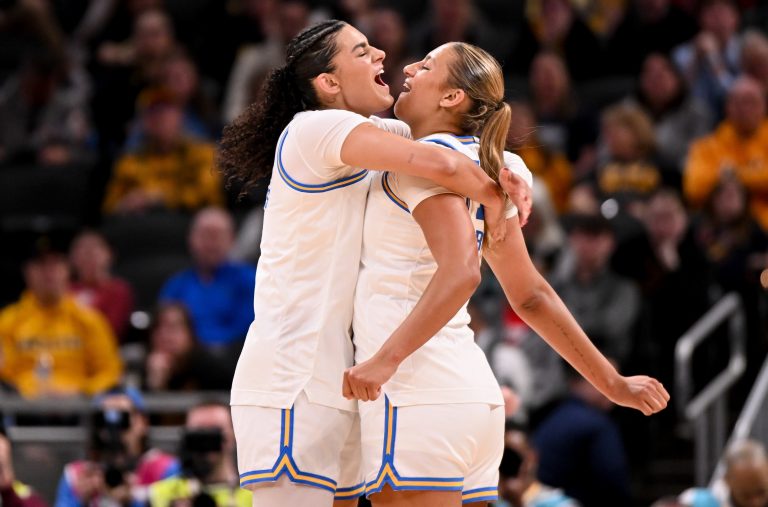 UCLA Bruins center Lauren Betts (51) and UCLA Bruins forward Sienna Betts (16) celebrate after a play against the Iowa Hawkeyes during the first half at Gainbridge Fieldhouse. 
Source: Imagn