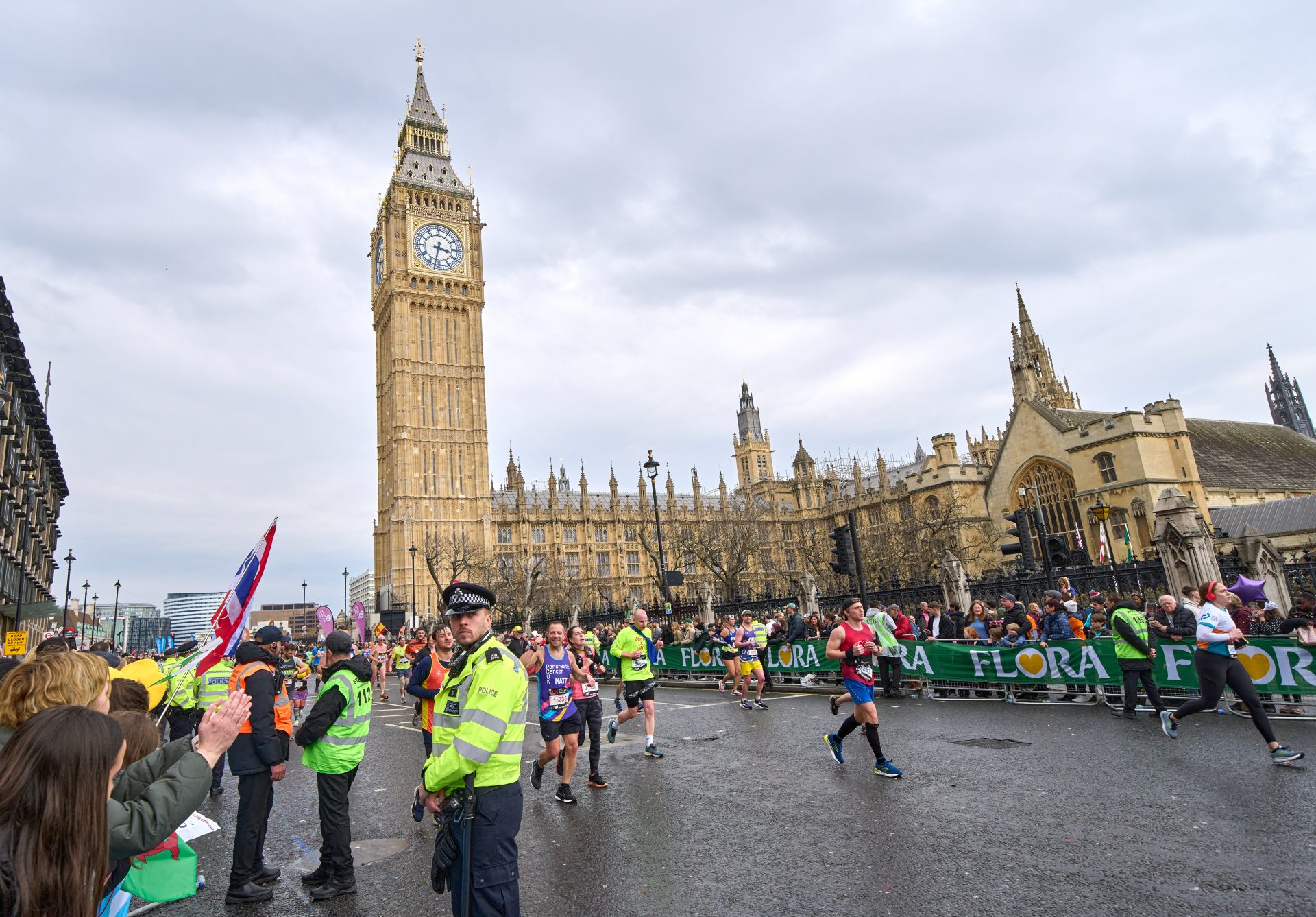 Competitors pass by Big Ben and the houses of Parliament in Westminster during the London Marathon.