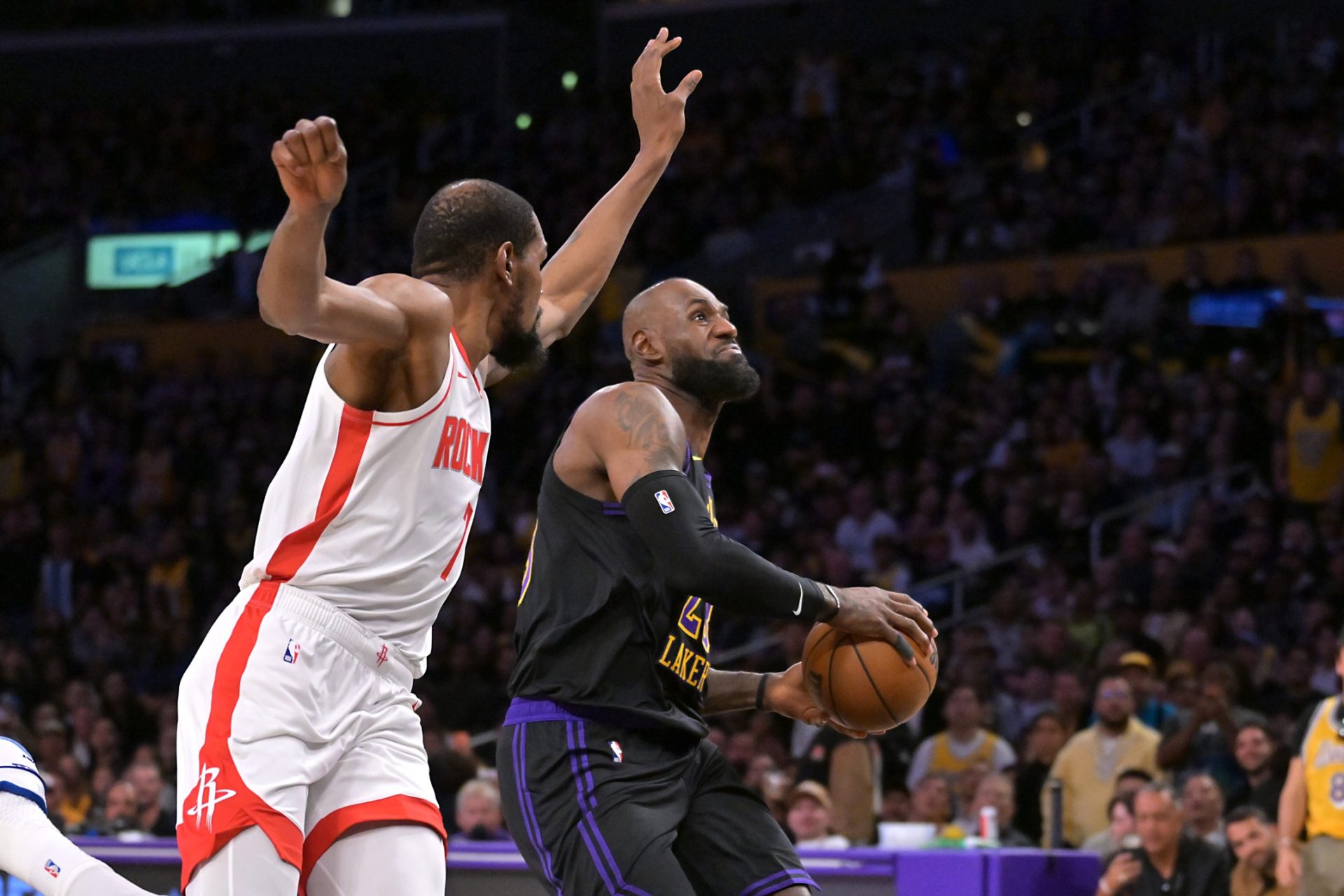 Los Angeles Lakers forward LeBron James (23) drives past Houston Rockets forward Kevin Durant (7) in the first half of game two of the first round of the 2026 NBA Playoffs against the Houston Rockets at Crypto.com Arena.