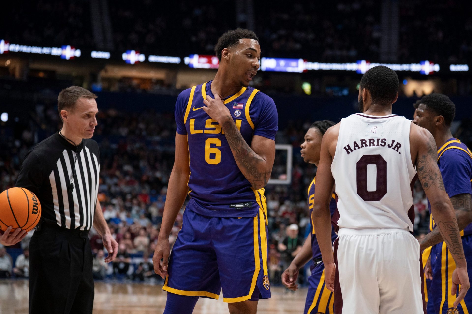 LSU Tigers forward Robert Miller III (6) offers some choice words for Mississippi State Bulldogs guard Claudell Harris Jr. on March 12. Source: Imagn