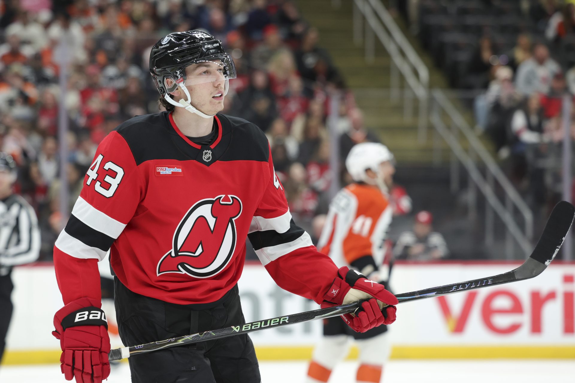 New Jersey Devils defender Luke Hughes (43) takes a break during a stoppage in play against the Philadelphia Flyers during the first period at Prudential Center.
