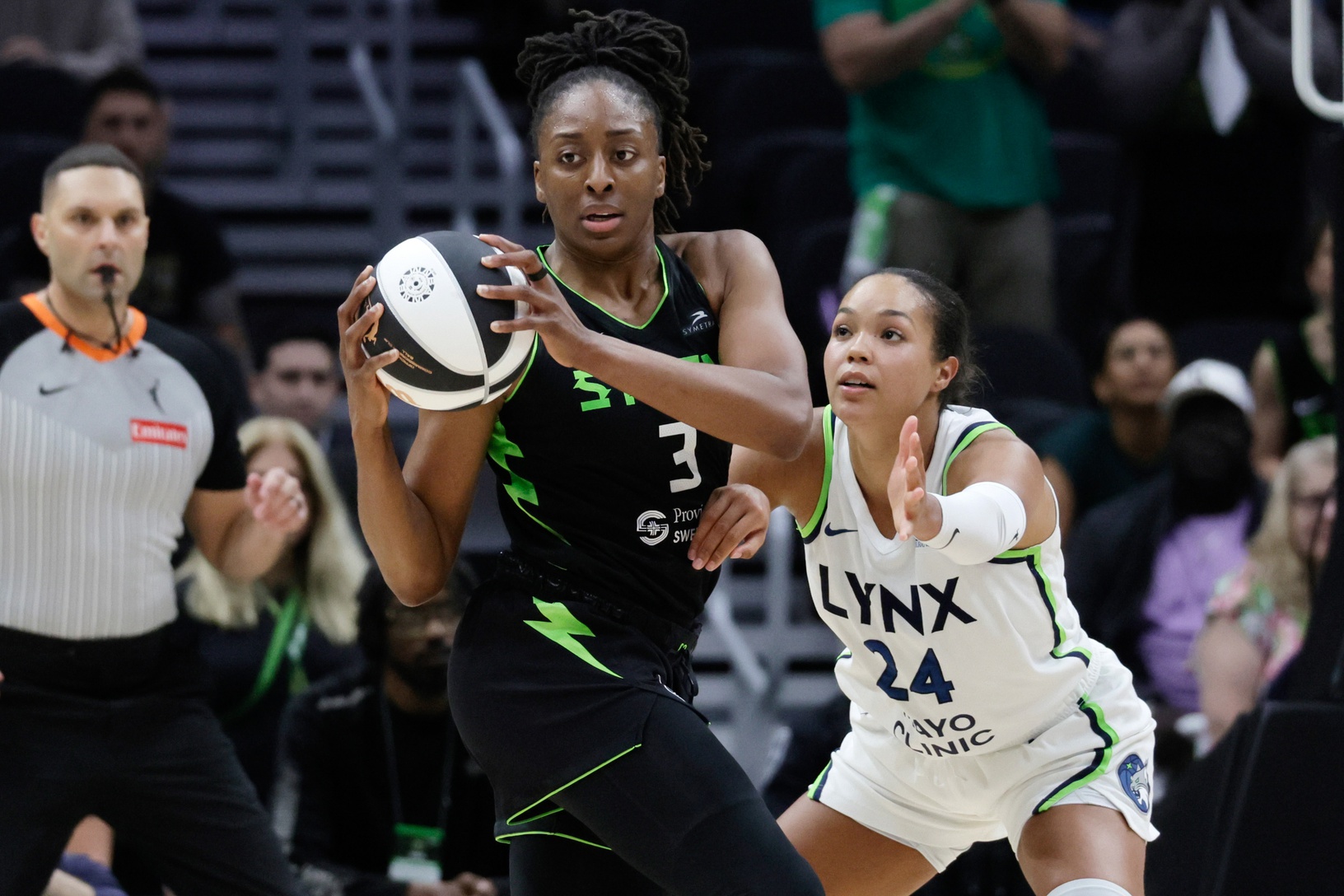 Seattle Storm forward Nneka Ogwumike (3) looks to pass with Minnesota Lynx forward Napheesa Collier (24) defending during the second half at Climate Pledge Arena. - Source: Imagn