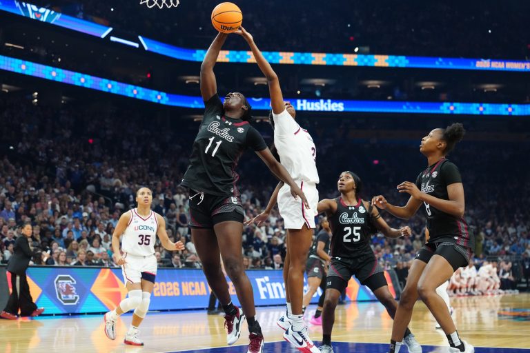 South Carolina Gamecocks center Madina Okot (11) and UConn Huskies forward Serah Williams (22) reach for a rebound in the first quarter during a semifinal of the Final Four of the women's 2026 NCAA Tournament at Mortgage Matchup Center. 
Source: Imagn
