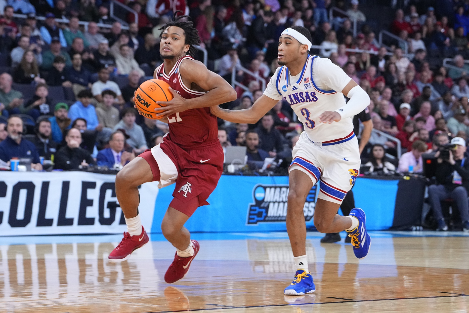 Arkansas Razorbacks guard D.J. Wagner (21) drives to the basket during the first quarter against the Kansas Jayhawks guard Dajuan Harris Jr. (3) at Amica Mutual Pavilion. Source: Imagn