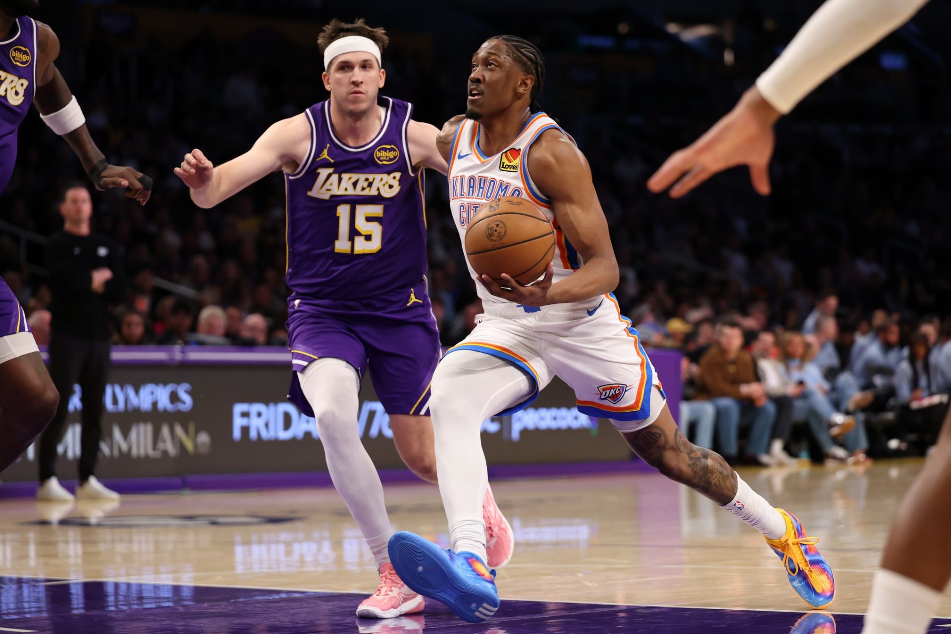Oklahoma City Thunder guard Jalen Williams (8) goes to the basket against Los Angeles Lakers guard Austin Reaves (15) during the first half at Crypto.com Arena - Source: Imagn Images
