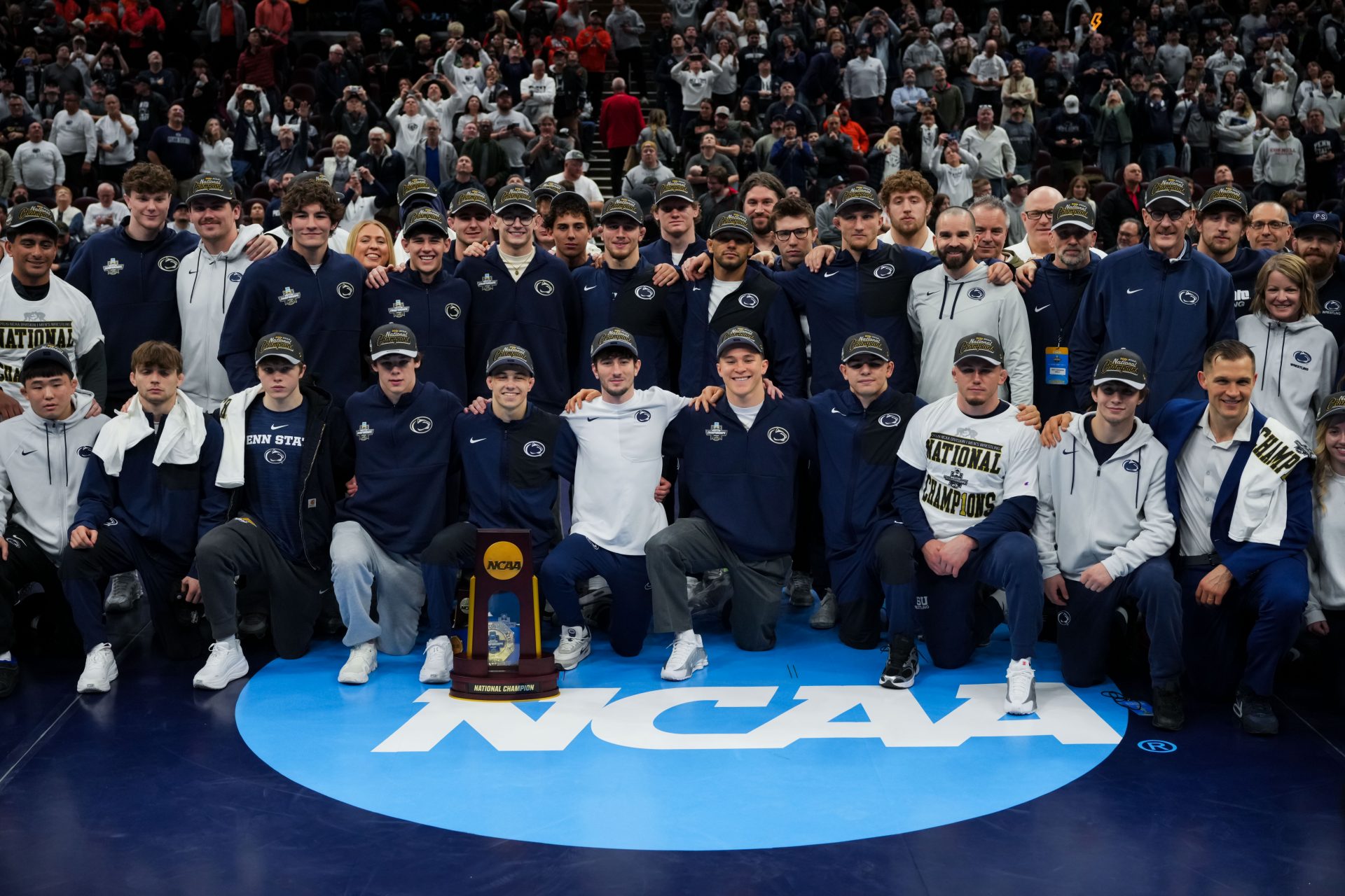 Members of the Penn State Nittany Lions pose for a photo after the NCAA DI Wrestling Championship at Rocket Arena.