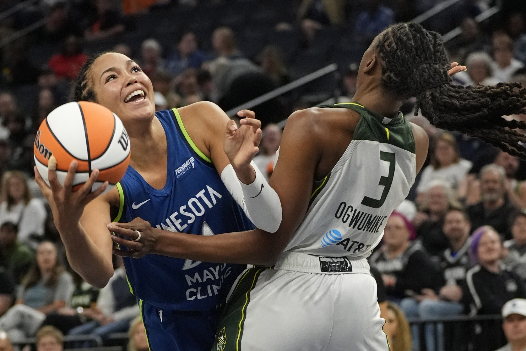 Minnesota Lynx forward Napheesa Collier (24) goes to the basket against Seattle Storm forward Nneka Ogwumike (3) in the third quarter at Target Center - Source: Imagn Images