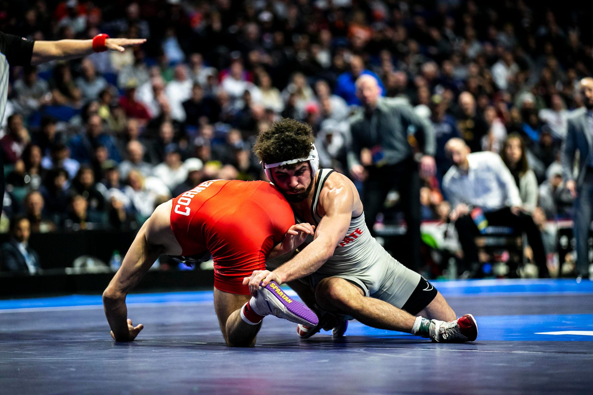 Yianni Diakomihalis, left, wrestles Sammy Sasso - IMAGN