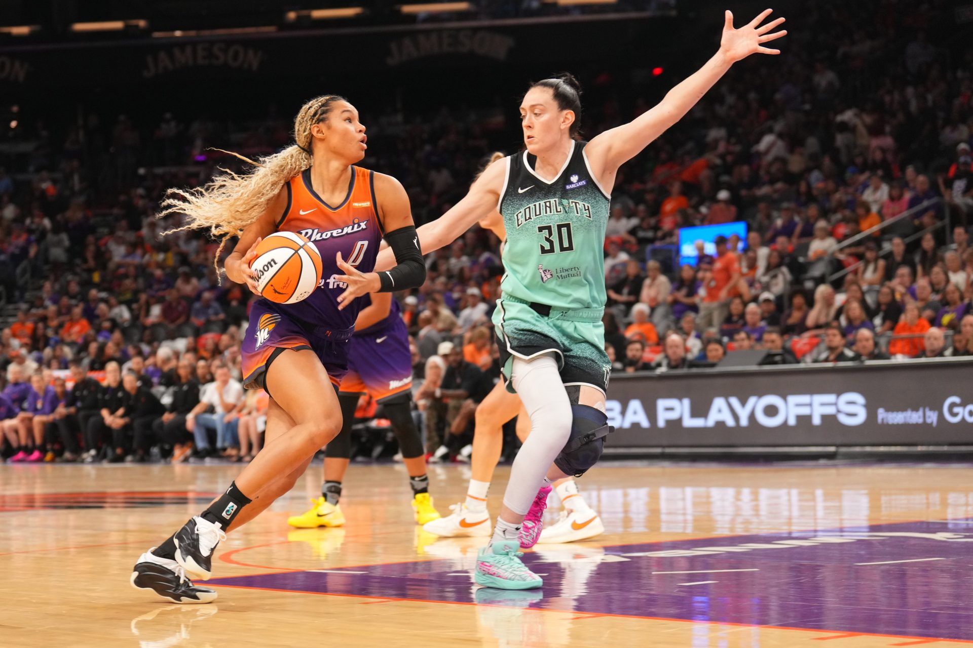 Phoenix Mercury forward Satou Sabally (0) dribbles against New York Liberty forward Breanna Stewart (30) during the second half of game three of round one for the 2025 WNBA Playoffs at PHX Arena - Source: Imagn Images