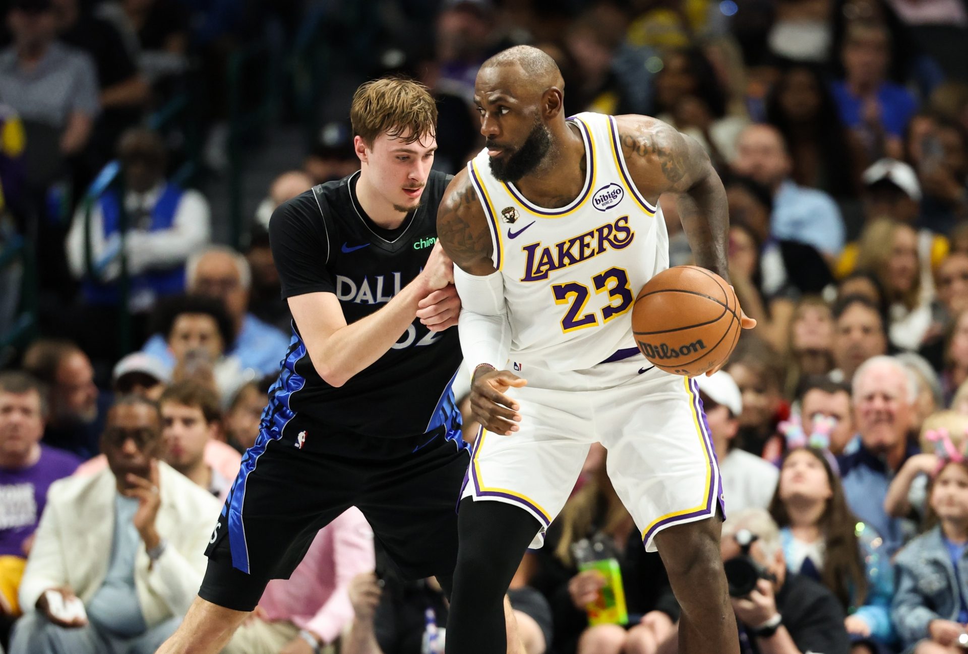 Los Angeles Lakers forward LeBron James (23) controls the ball as Dallas Mavericks forward Cooper Flagg (32) defends during the first half at American Airlines Center. - Source: Imagn