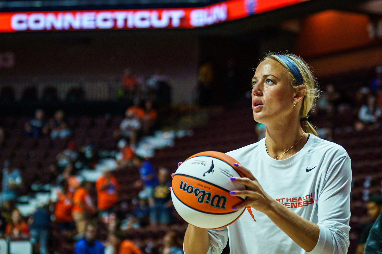 Indiana Fever guard Sophie Cunningham (8) warms up before the start of the game against the Connecticut Sun at Mohegan Sun Arena. - Source: Imagn