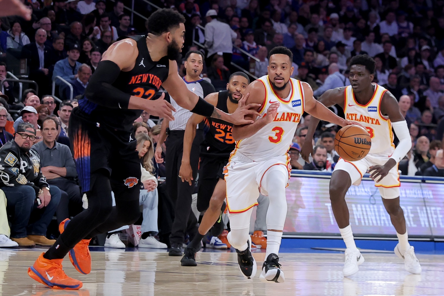 Atlanta Hawks guard CJ McCollum (3) controls the ball against New York Knicks center Karl-Anthony Towns (32) during the third quarter of game two of the first round of the 2026 NBA Playoffs at Madison Square Garden. - Source: Imagn