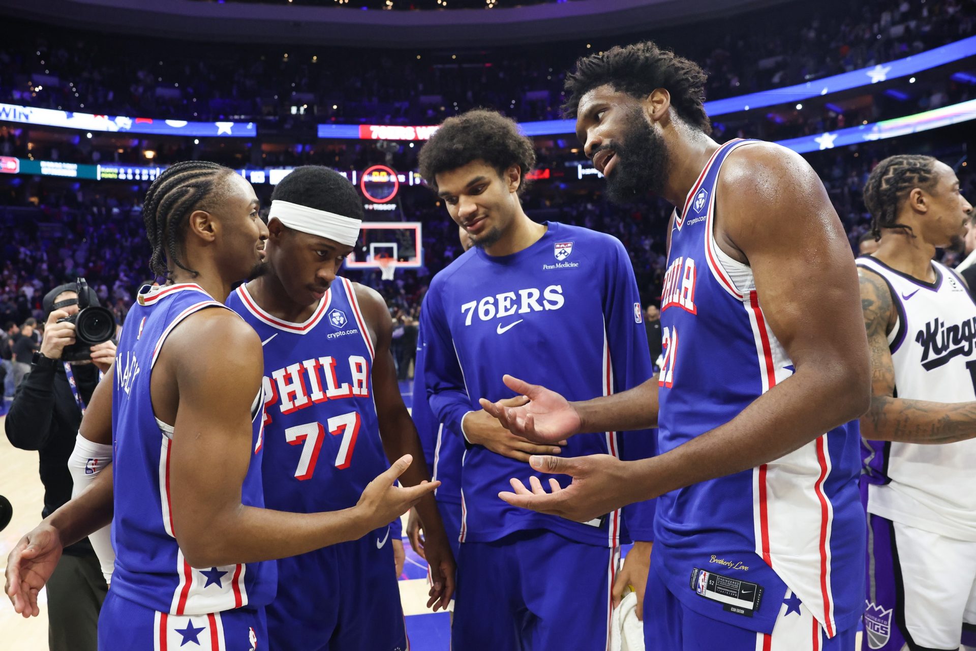 Philadelphia 76ers center Joel Embiid (21) reacts with Philadelphia 76ers guard Tyrese Maxey (L) in front of guard Vj Edgecombe (77) after a victory against the Sacramento Kings at Xfinity Mobile Arena. -Source: Imagn