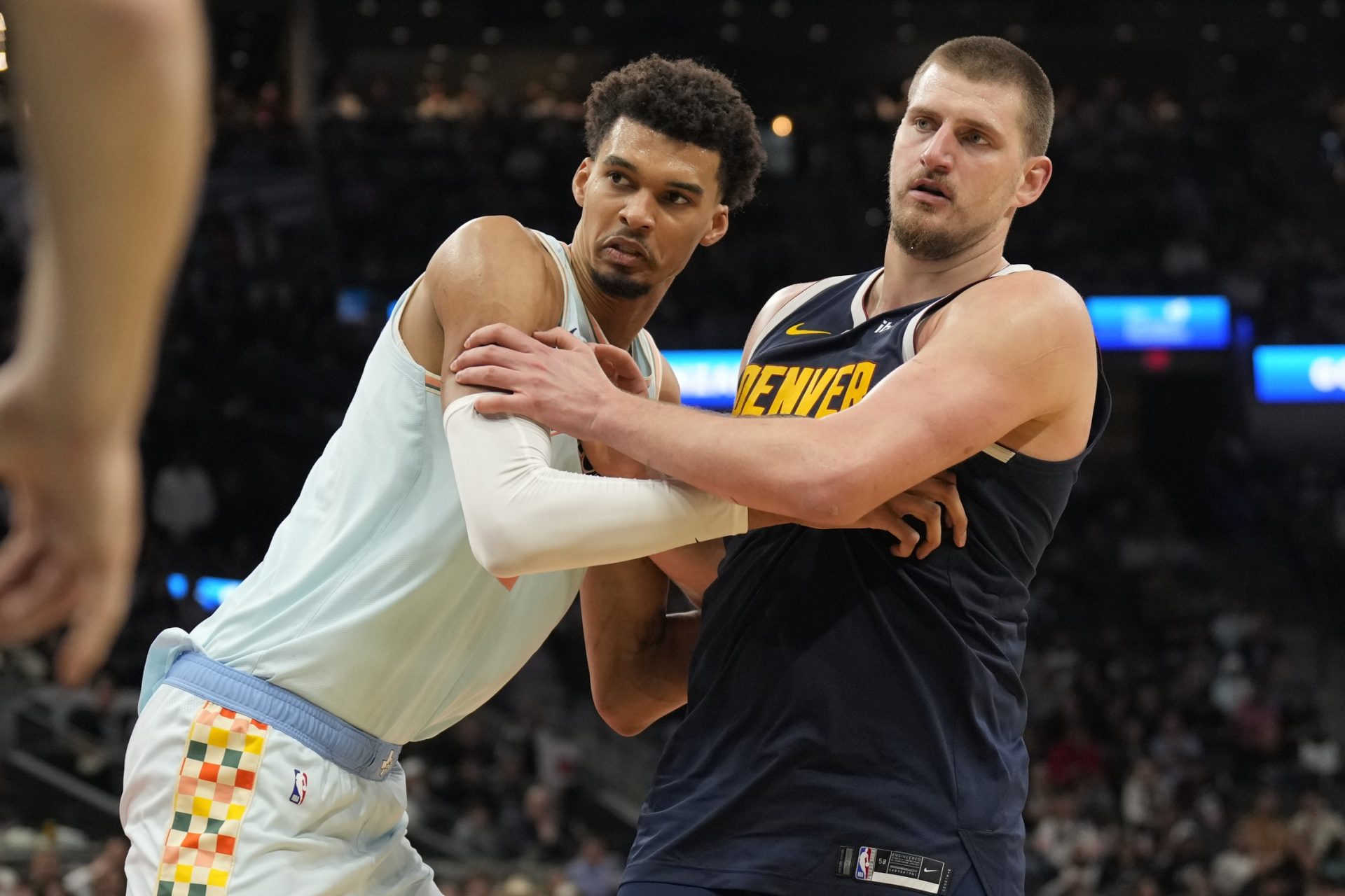 San Antonio Spurs center Victor Wembanyama (1) and Denver Nuggets center Nikola Jokic (15) battle for position during an inbound pass in the second half at Frost Bank Center.