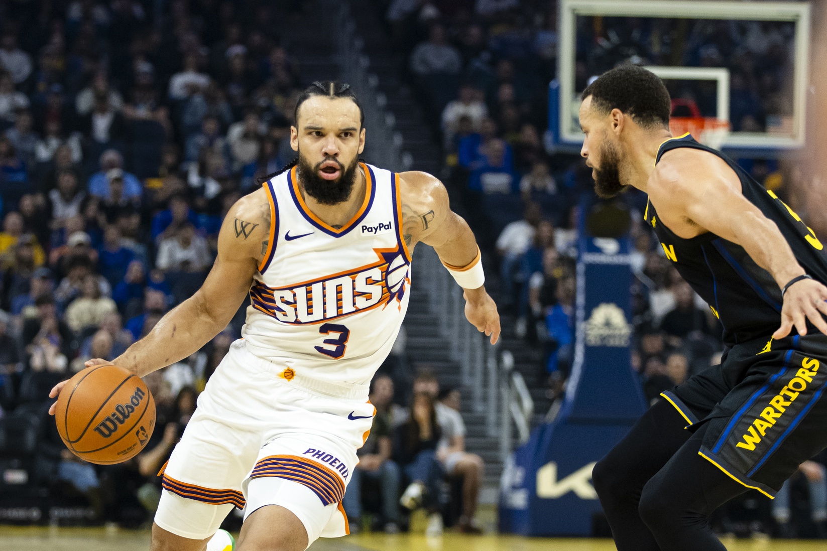 Phoenix Suns forward Dillon Brooks (3) drives past Golden State Warriors guard Stephen Curry (30) during the first quarter at Chase Center. - Source: Imagn