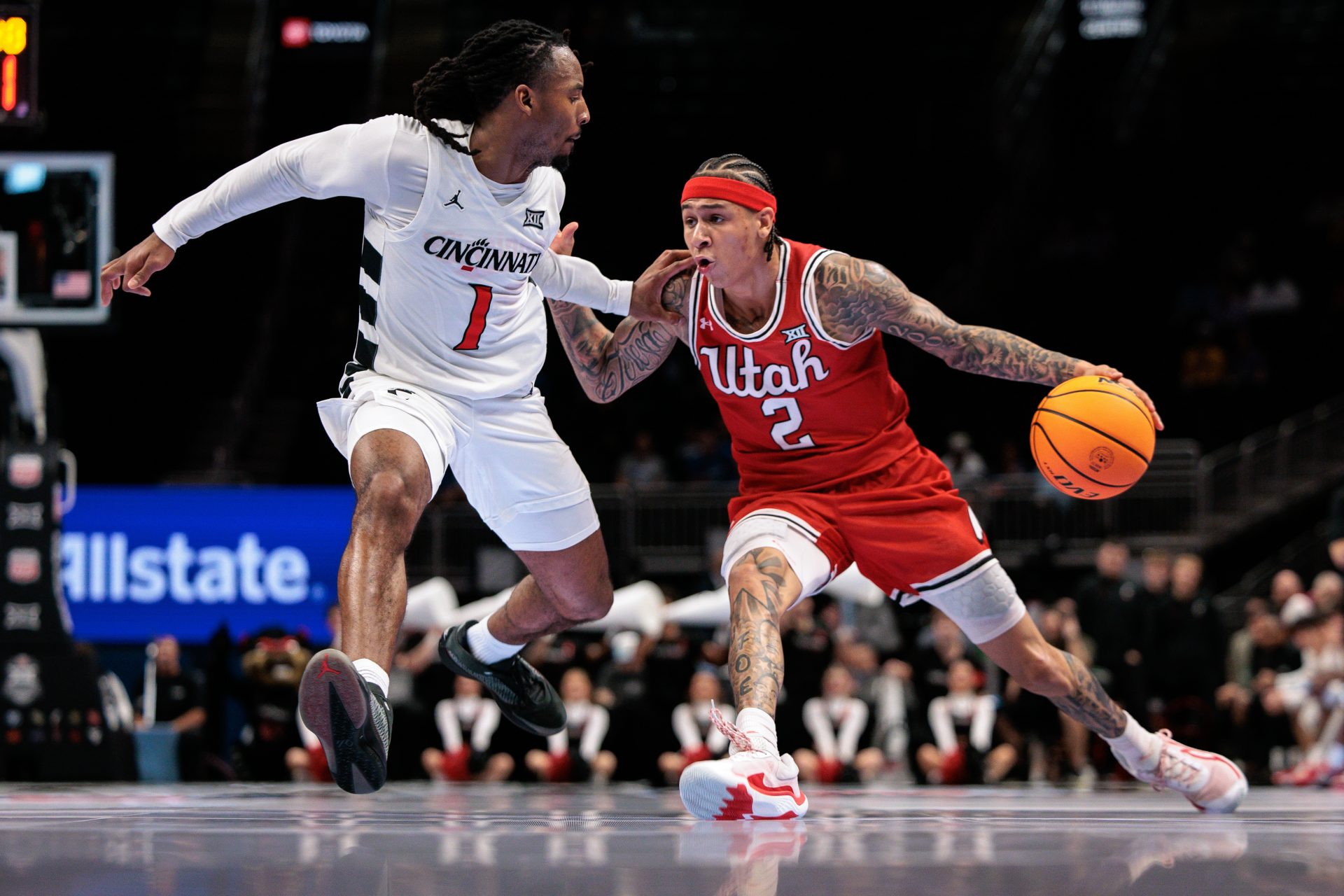 Utah Utes guard Terrence Brown (2) drives around Cincinnati Bearcats guard Day Day Thomas at T-Mobile Center. Source: IMAGN
