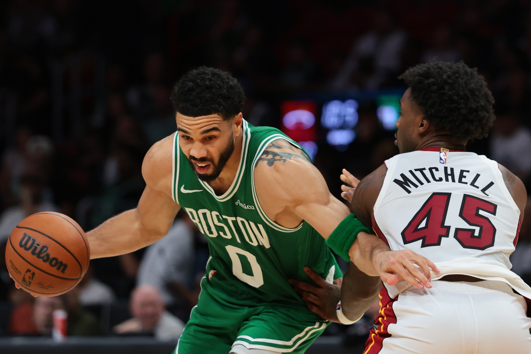 Boston Celtics forward Jayson Tatum (0) drives to the basket against Miami Heat guard Davion Mitchell (45) during the third quarter at Kaseya Center. - Source: Imagn